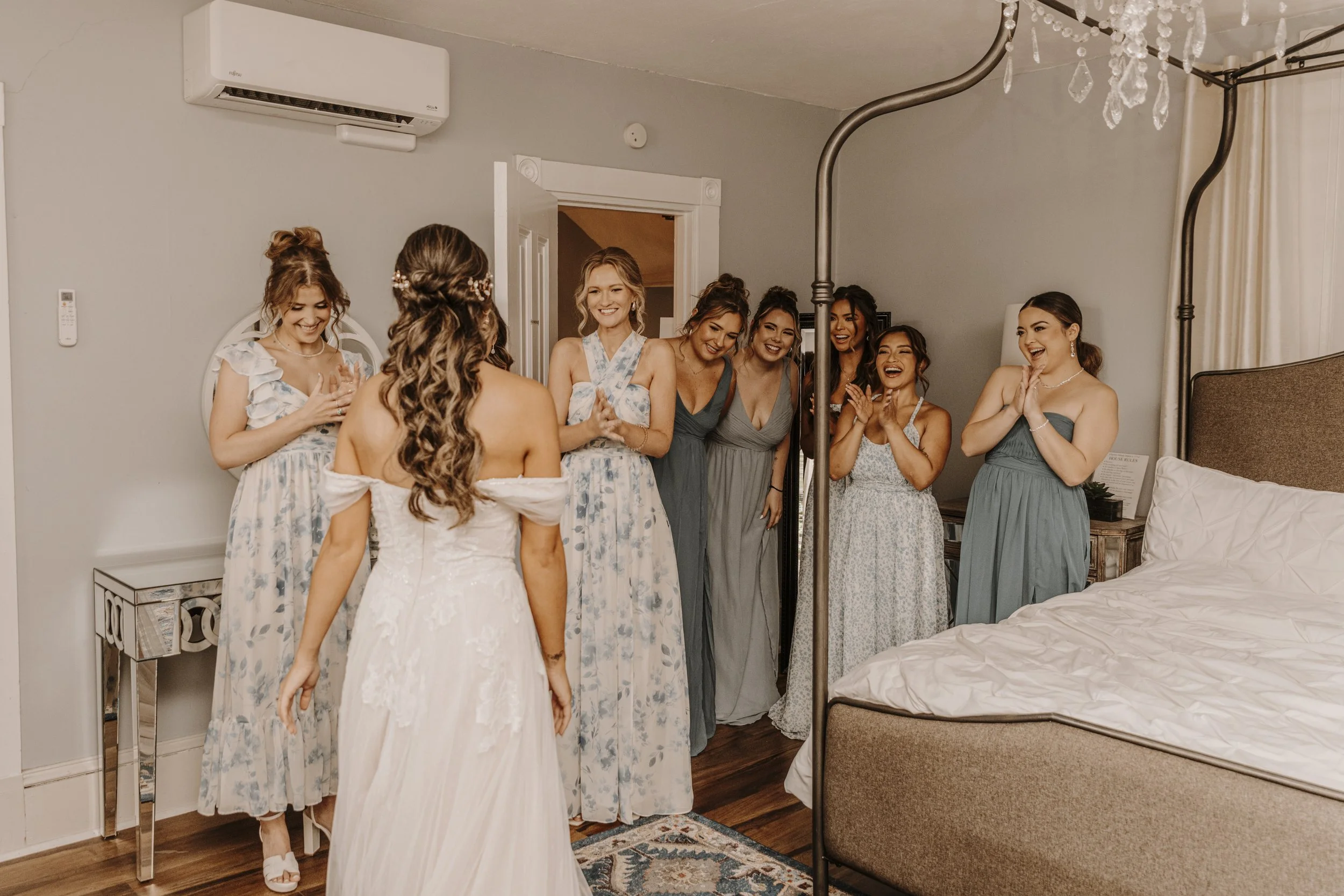 Bridesmaids with bride in bridal suite