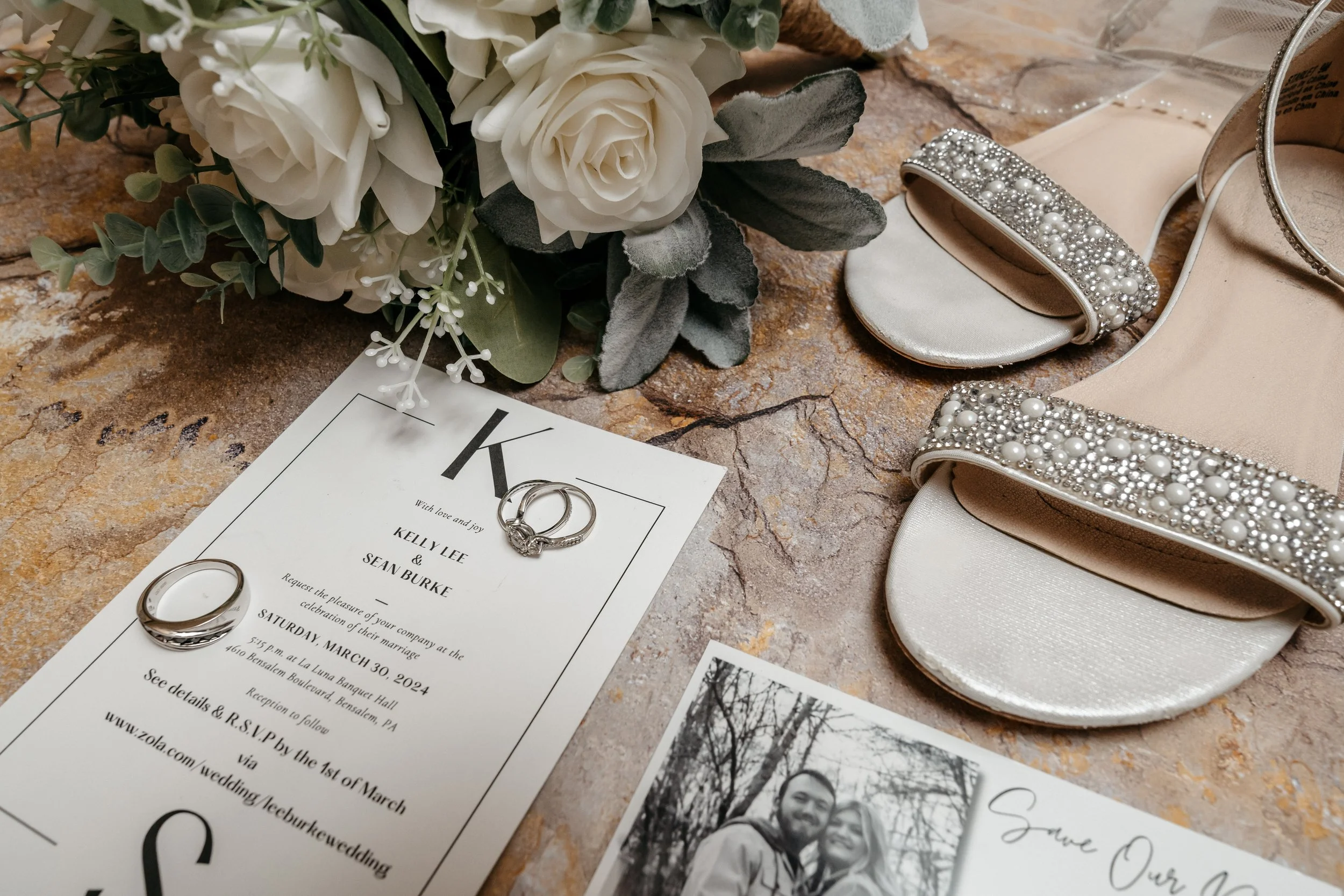 Wedding shoes, rings and invitations