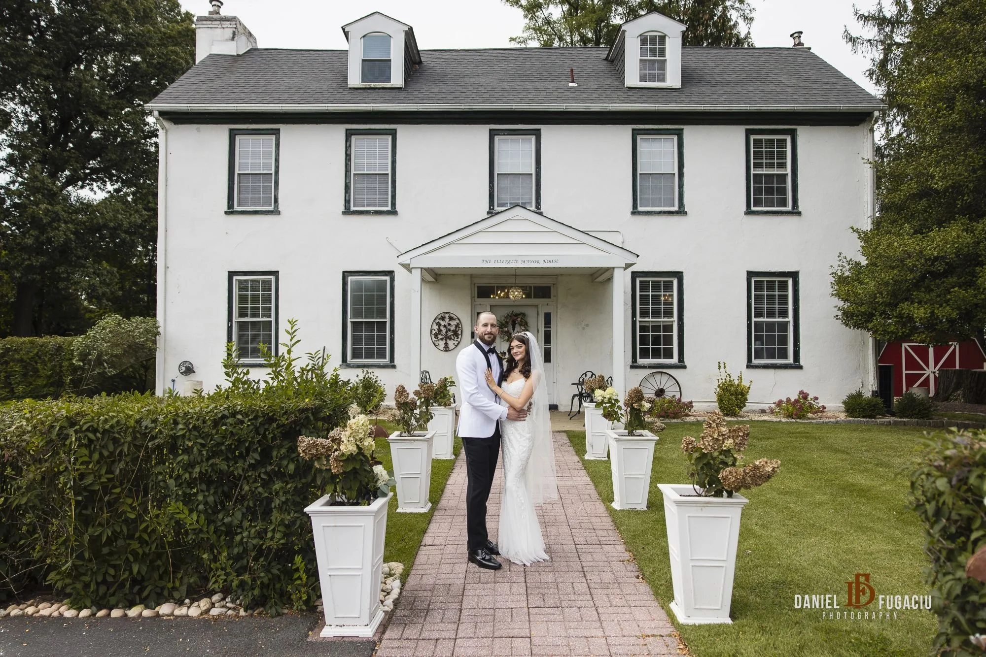 Bride and groom on manor walk way