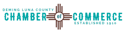Seal of Deming Luna County Chamber of Commerce with text and a cross design