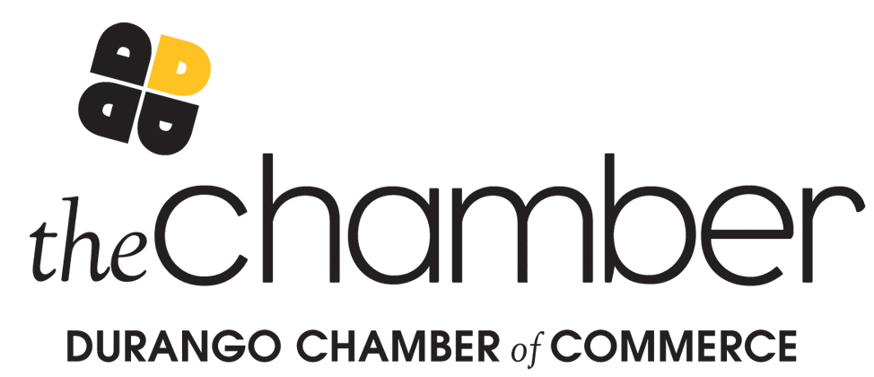 Logo of the Durango Chamber of Commerce featuring a four-leaf clover design in black and yellow and the text 'the chamber' with 'DURANGO CHAMBER of COMMERCE' underneath.