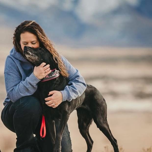 Hayden, the 'Heart' of the Wasatch legacy, sharing a deep bonding moment with Lead Instructor Theresa, symbolizing the connection and spirit that defines the company's foundation.
