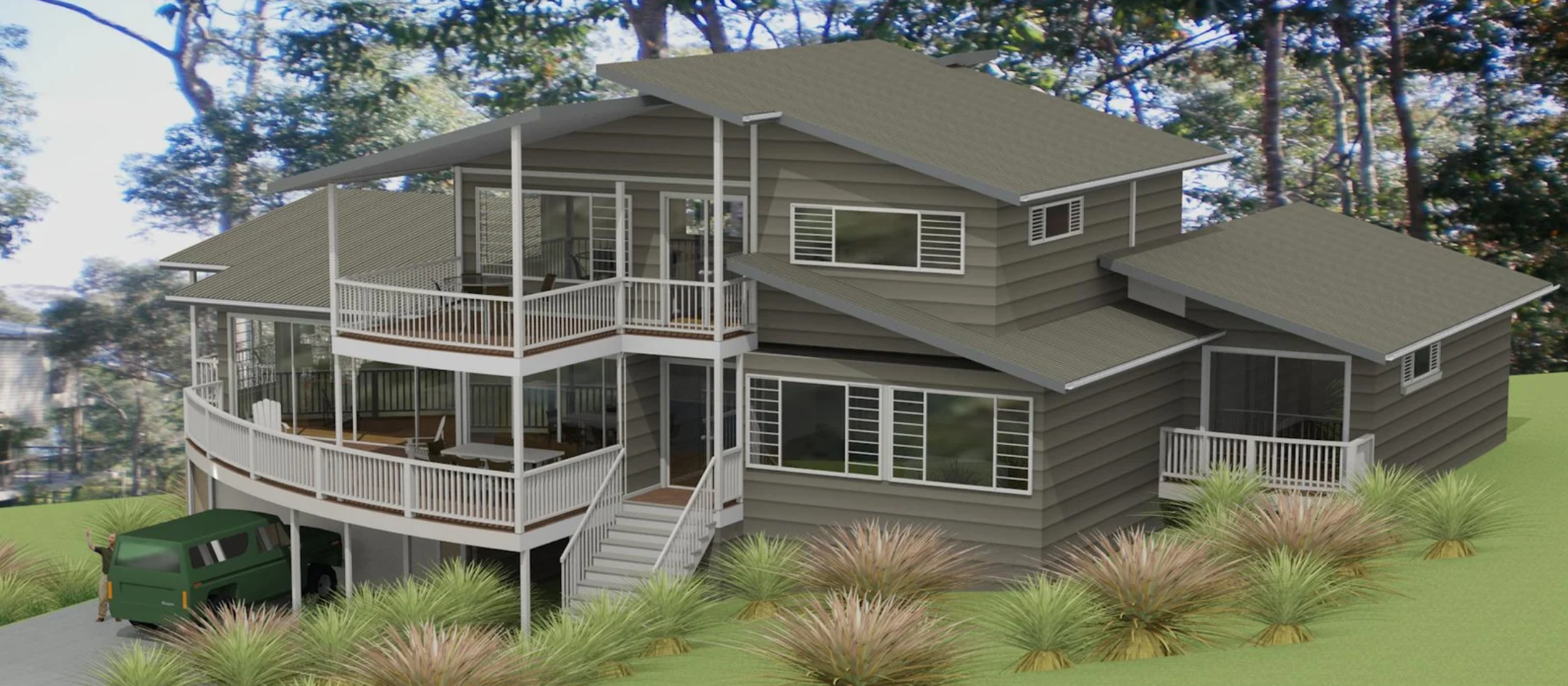 A modern, multi-story house with wood siding, numerous large windows, and wrap-around balconies with white railings. The house is surrounded by landscaped greenery and tall trees, with a driveway and a green vehicle parked underneath the house.