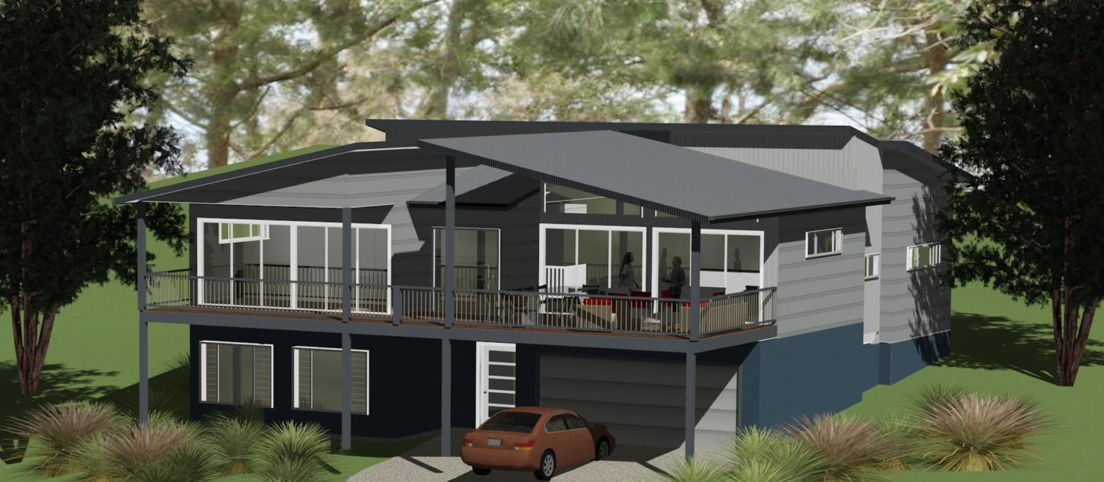 A two-story house with a large wraparound deck, gray exterior, multiple large windows, and a brown car parked in front on a gravel driveway, surrounded by trees and bushes.