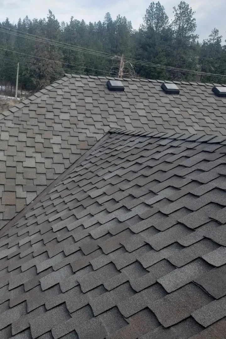 Rooftop view of newly installed shingles on a single-family home.