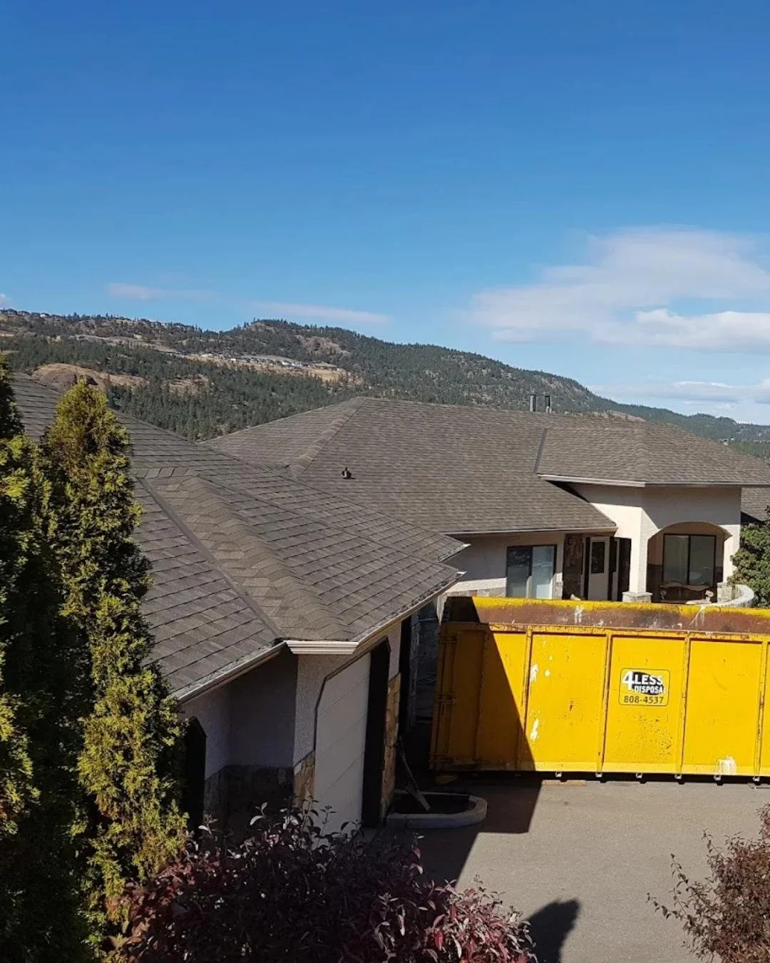 Rooftop view of newly installed shingles on a single-family home.