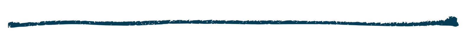 A woman holding a baby in a living room with colorful decorations, furniture, and a large window.