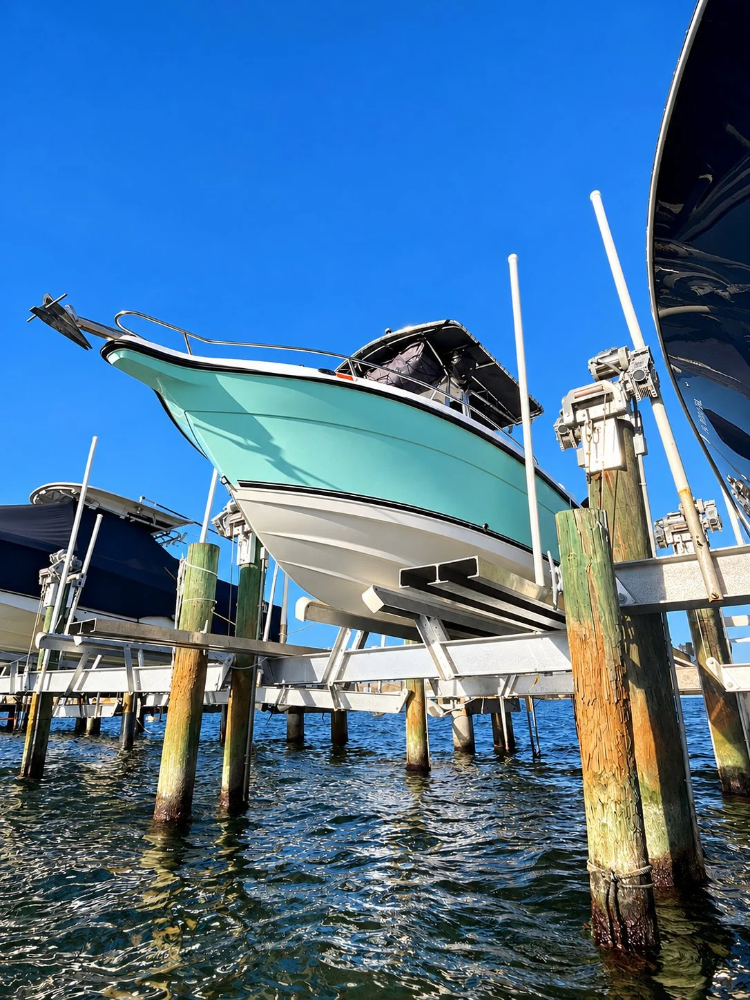 Seafoam Boat on Marina Lift(1).jpg