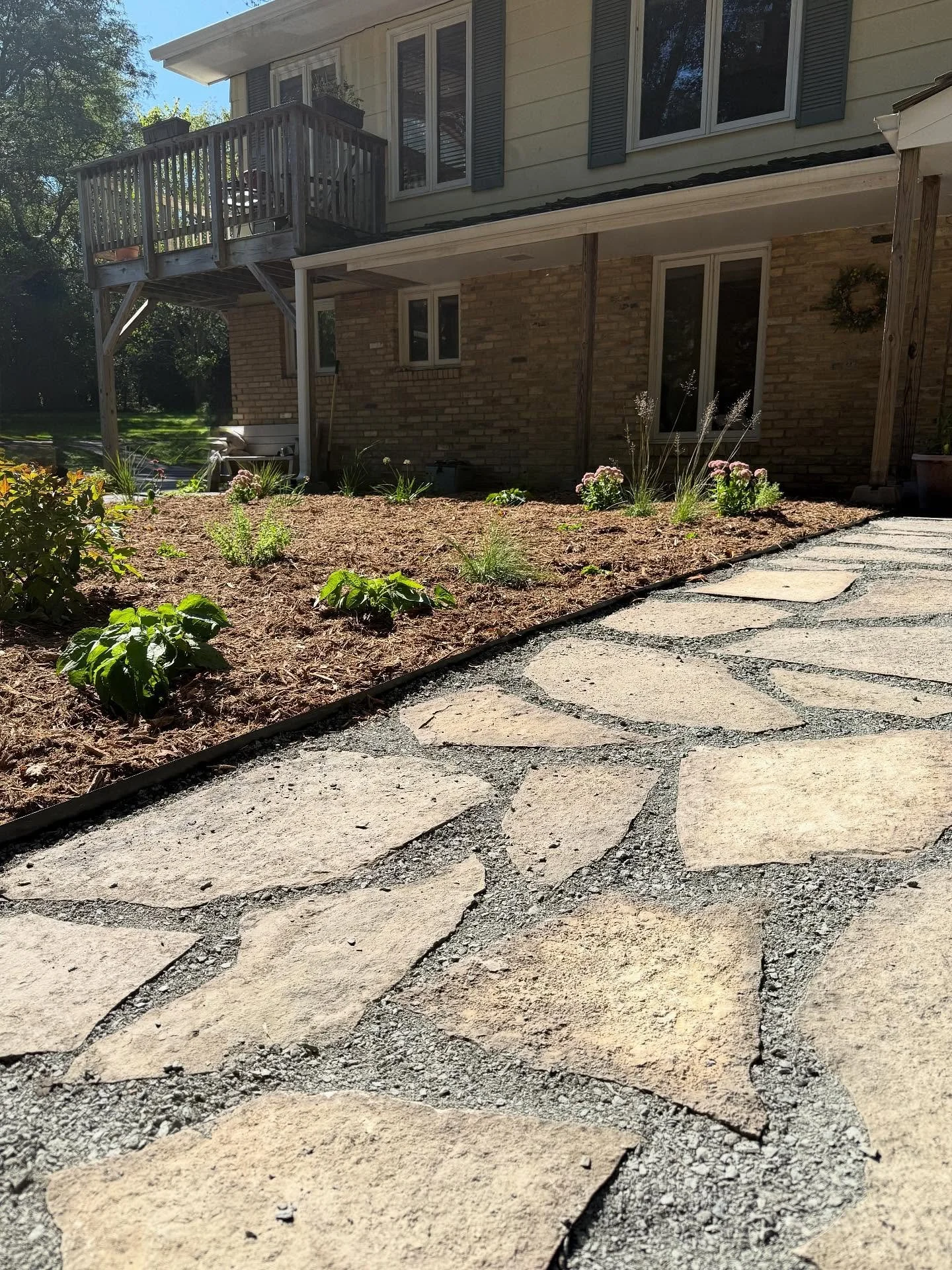 Our team had a lot of fun with this flip. We carved out defined garden spaces, uncovered and reused the stepping stones to create a clear path, and planted loads of pollinator-friendly plants around a mulched seating area. Swipe to see the mud pit we