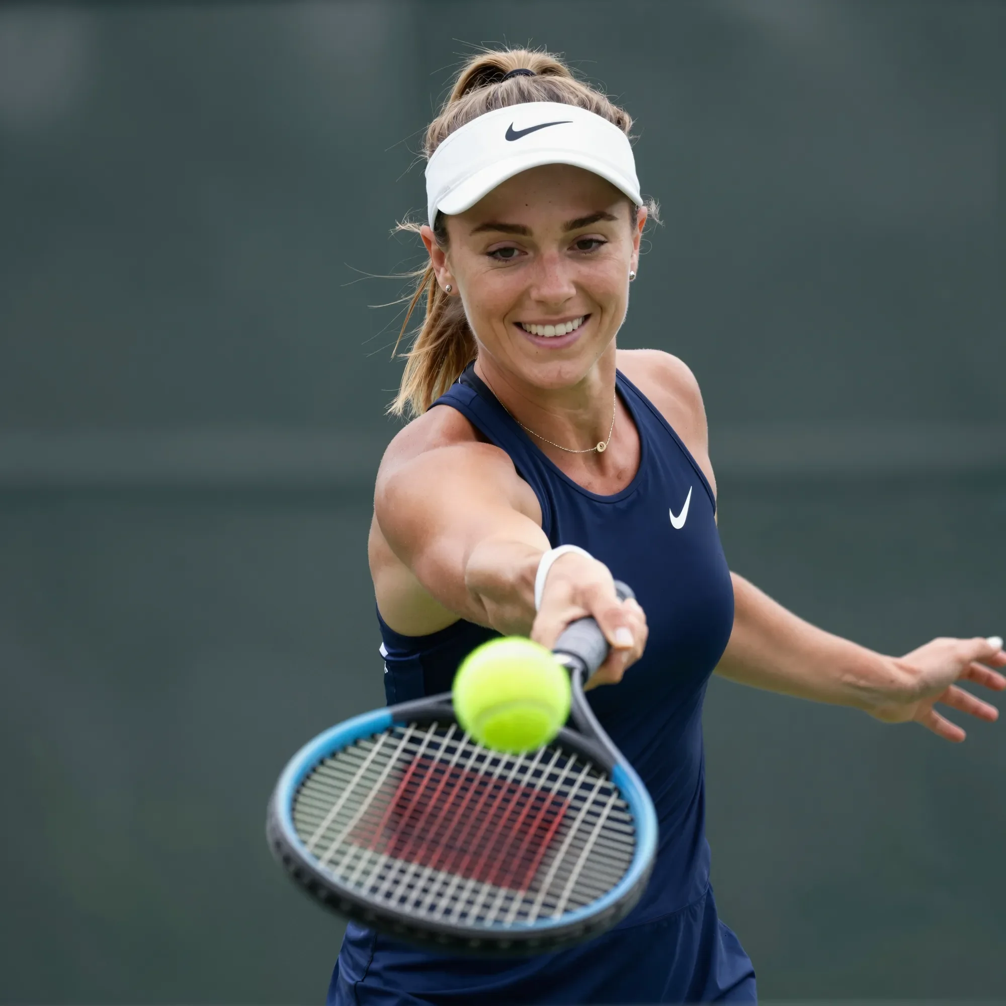 Tennis player in white outfit hitting a tennis ball with a racket on a tennis court.