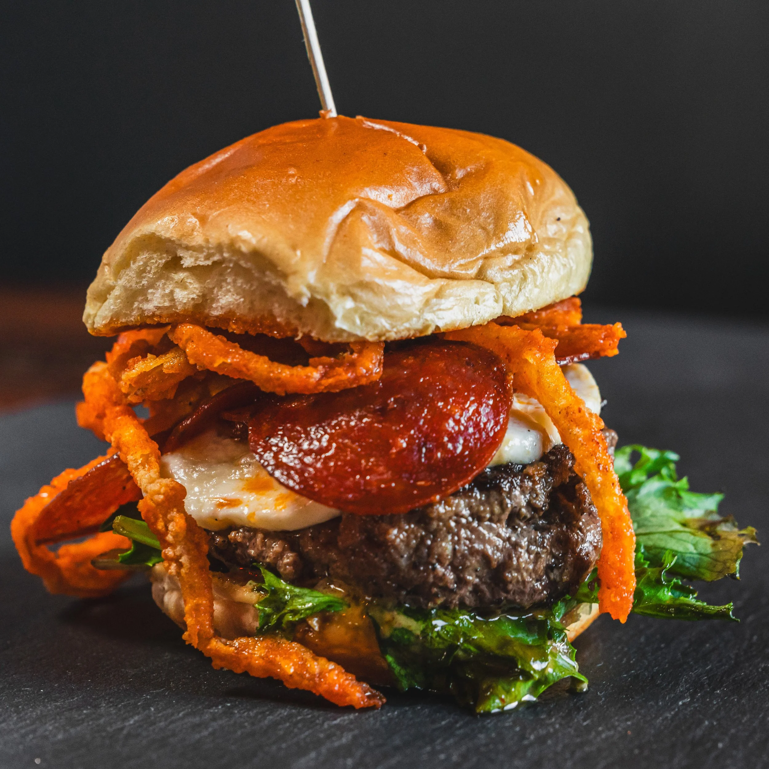 Close-up of a gourmet burger shot in a San Francisco restaurant.