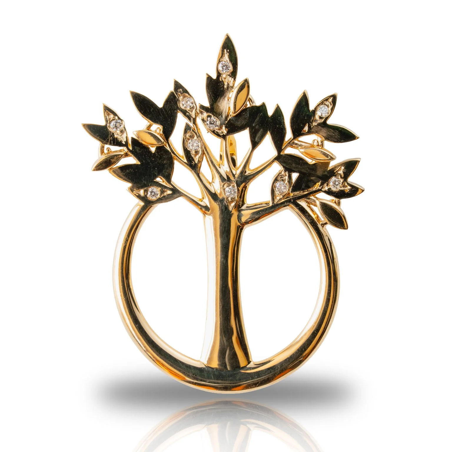 Gold ring with a tree and leaves design, adorned with small diamonds, on a white background.