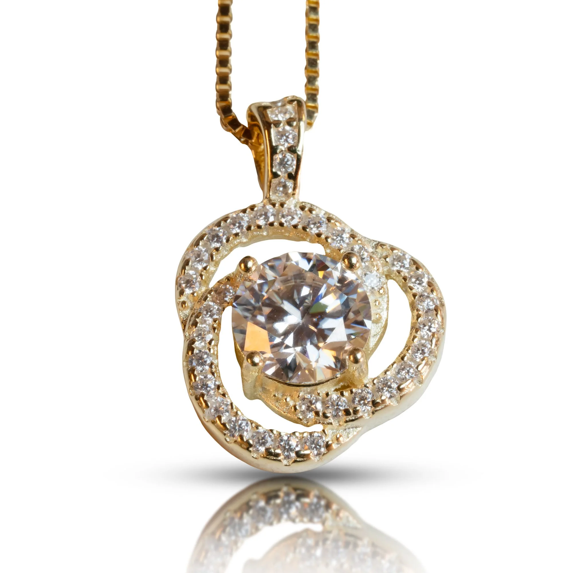 Gold necklace with a large round diamond pendant surrounded by smaller diamonds on a white background.