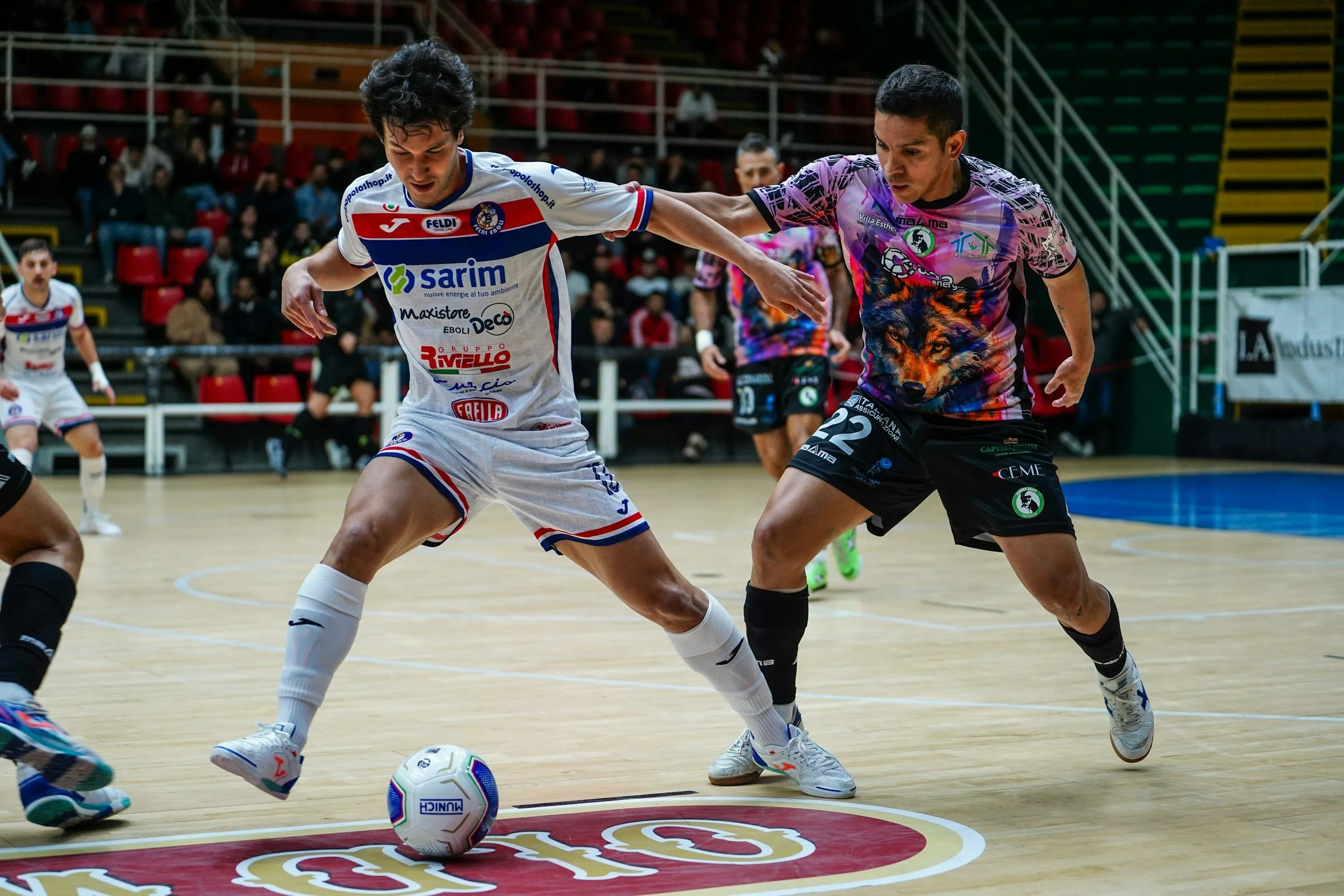 Man lifting a barbell at the gym, with workout plans on whiteboards in the background.