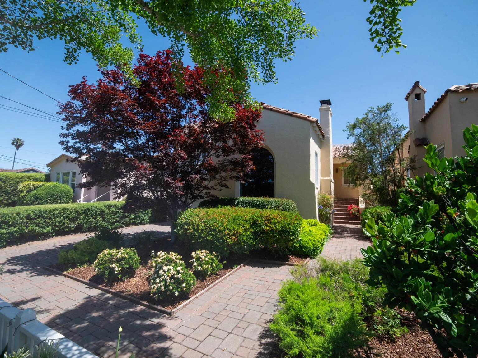 San Francisco skyline featuring the Transamerica Pyramid with surrounding buildings and busy street scene below.