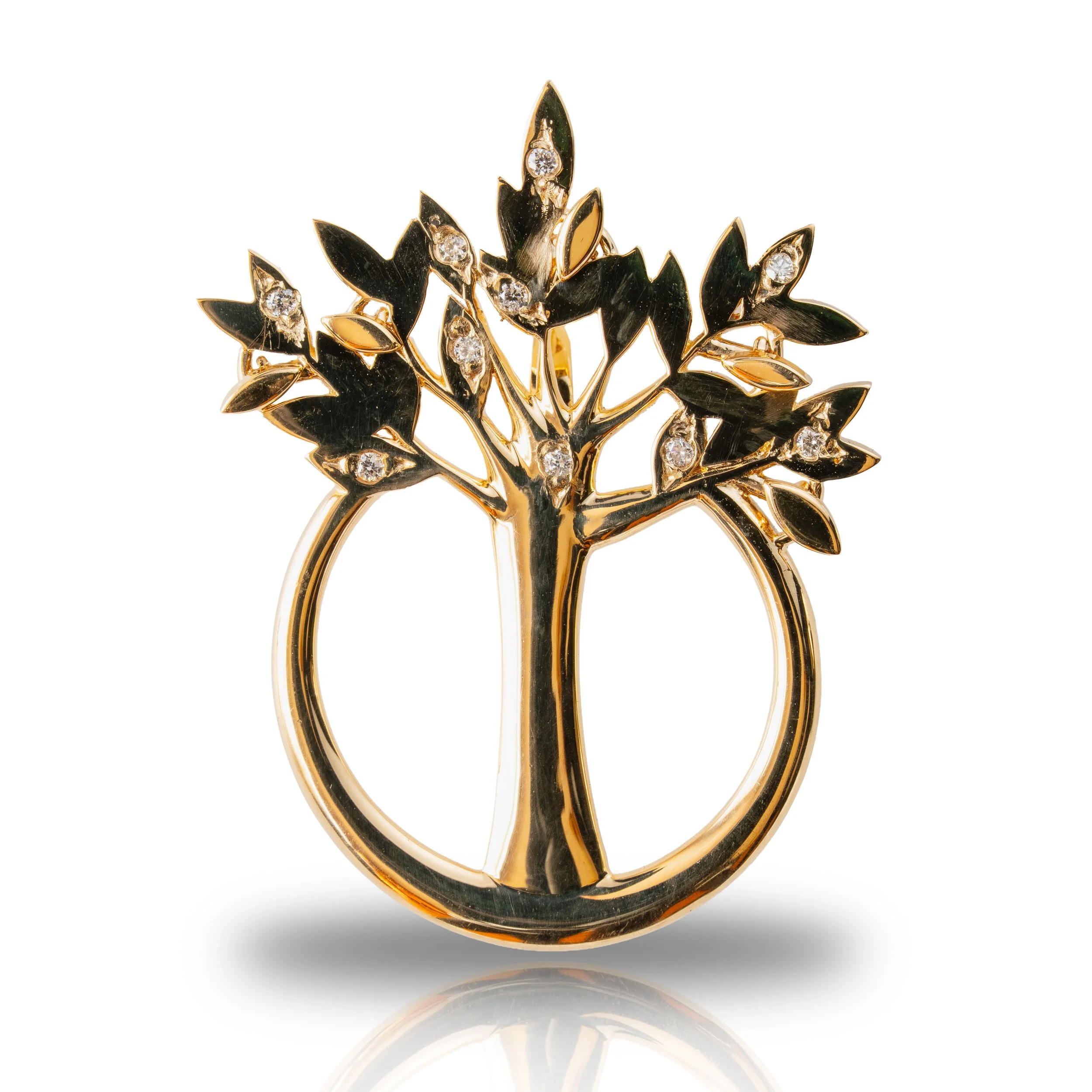 Gold ring designed as a tree with black leaves and small diamonds.