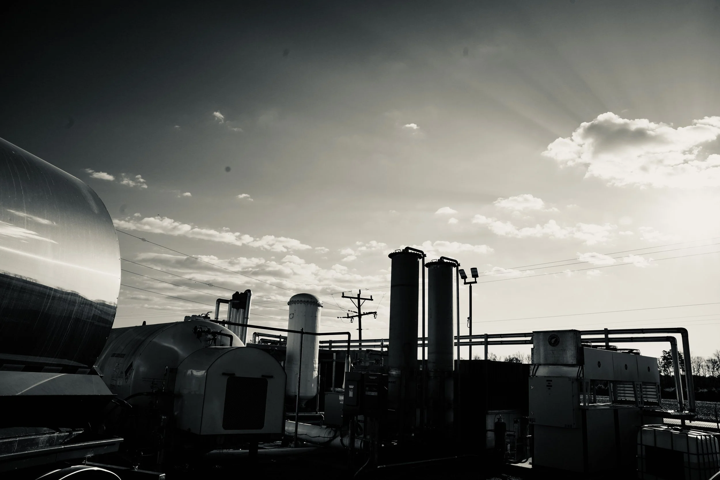 CleanCycleCarbon Lewiston facility from the side with CleanCycle's delivery tanker truck in the foreground.
