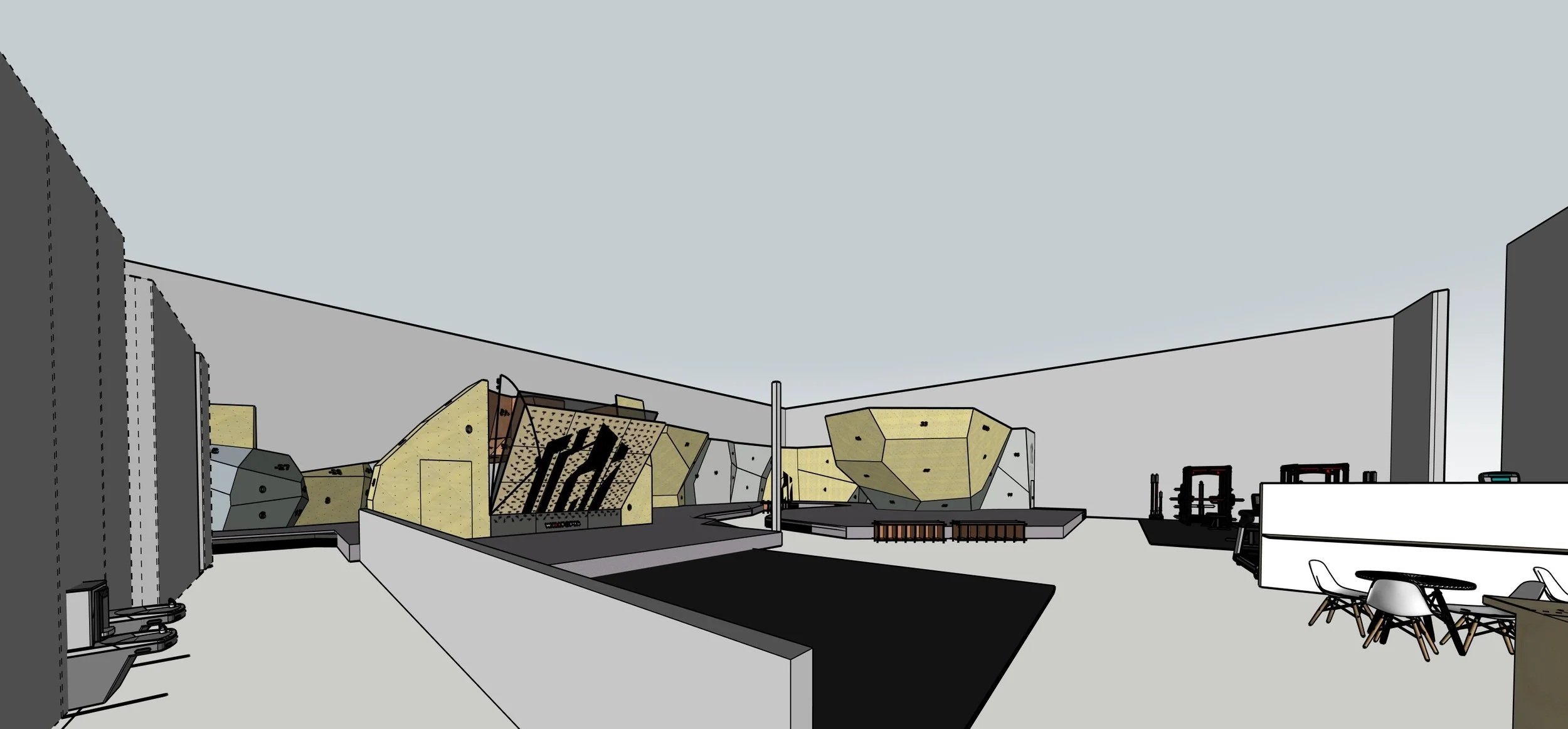 Interior of a modern climbing gym with various climbing walls and a seating area.