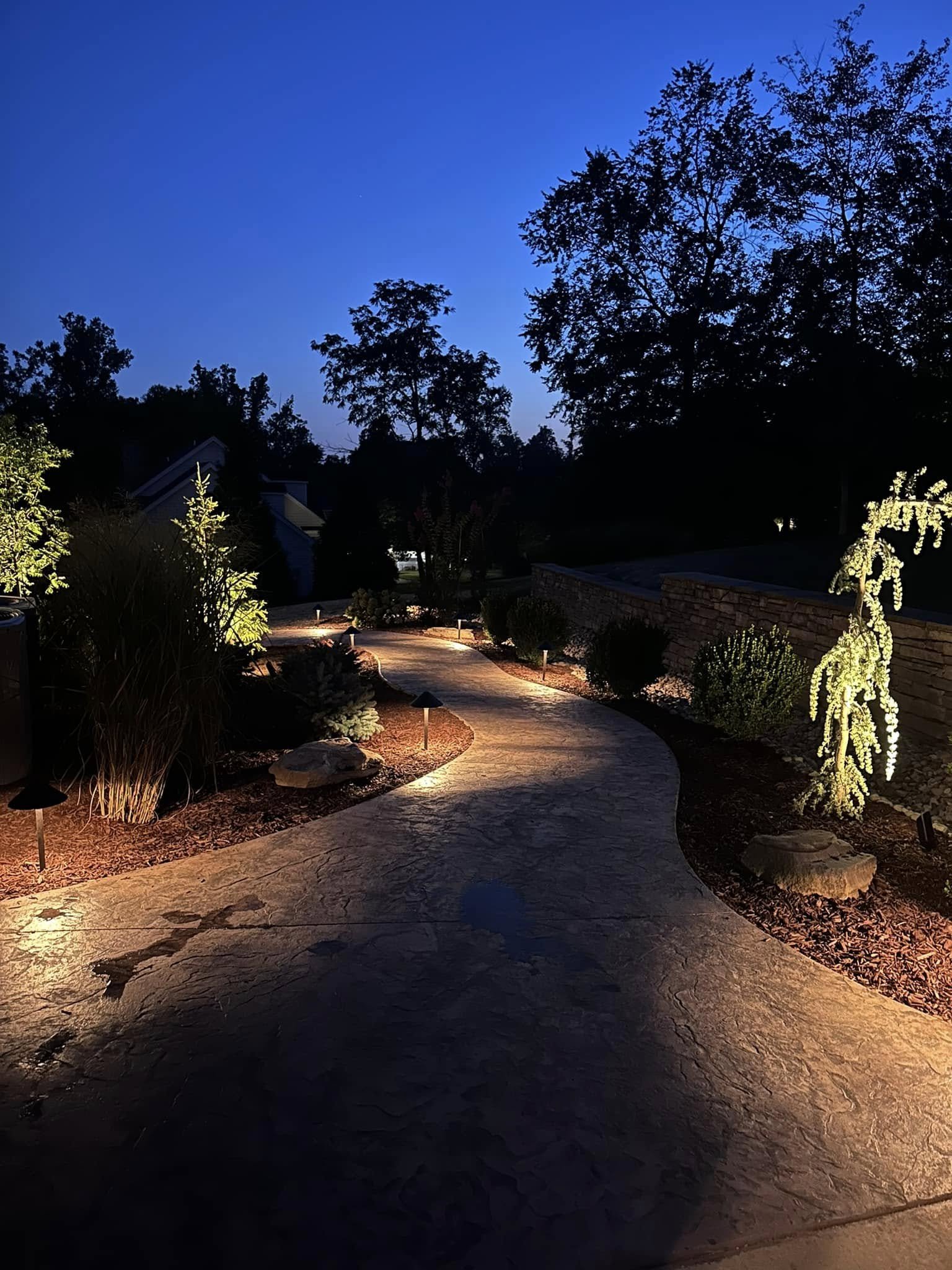 Modern house with large glass sliding doors, outdoor pool, and patio furniture, including lounge chairs and a dining table with chairs.