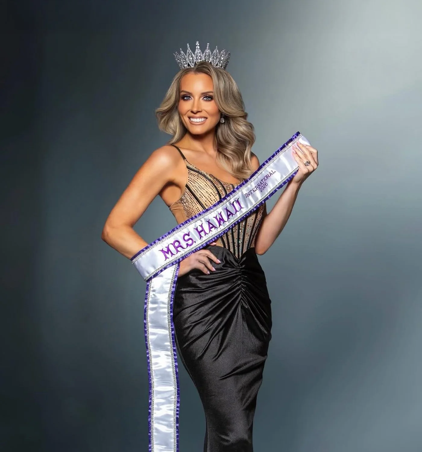 Jessica Lynn Silva wearing the Mrs. Hawaiʻi International 2026 crown and sash in an official portrait, attorney, author, speaker, coach, and advocate representing Hawaiʻi.