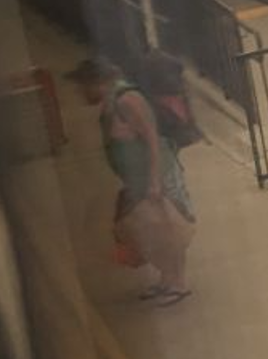 A zoomed in view of Jeremy Buzan as he is being kicked off the train.