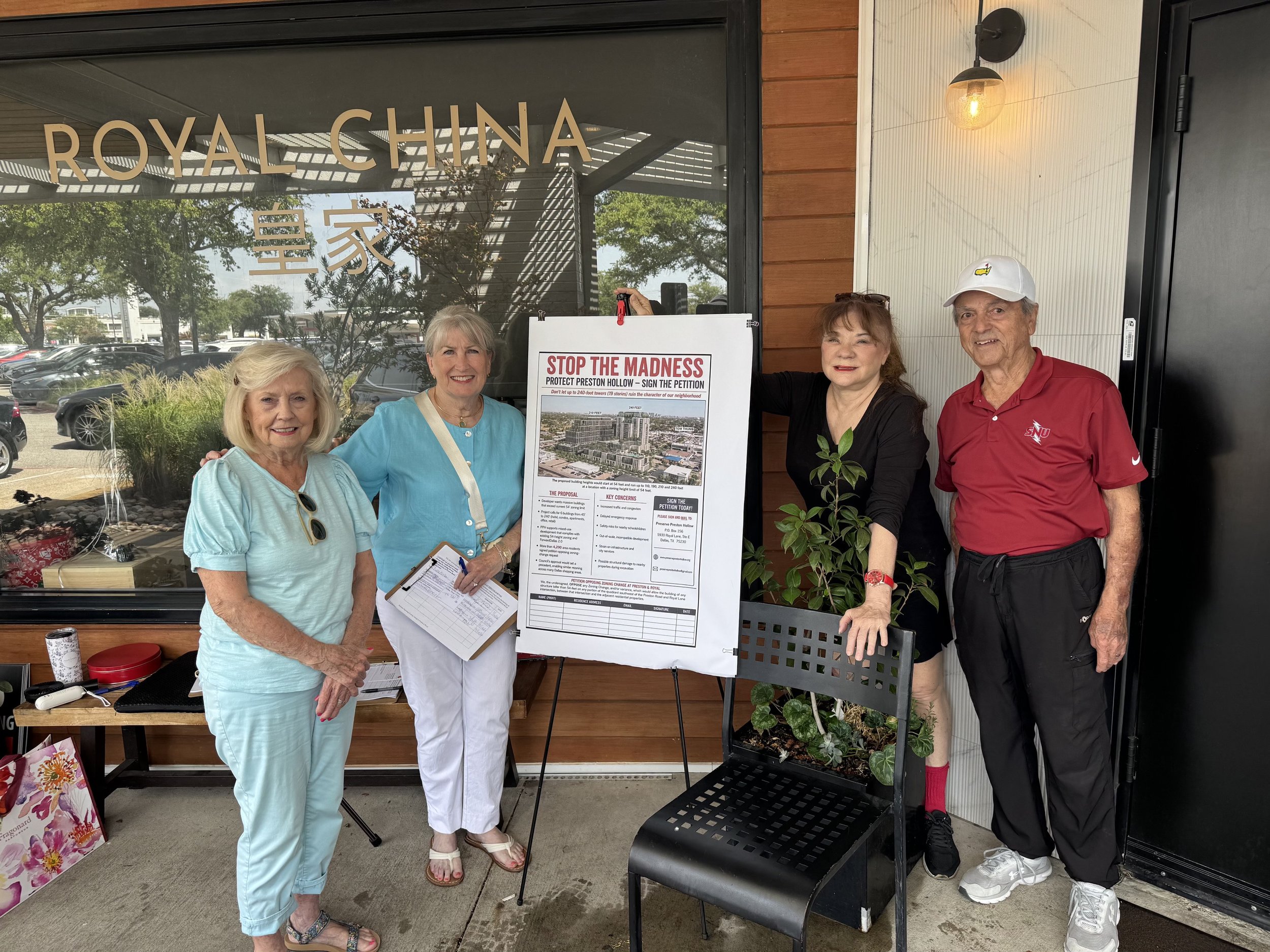 Preserve Preston Hollow volunteers get ready to talk to locals about the proposed zoning-change request.