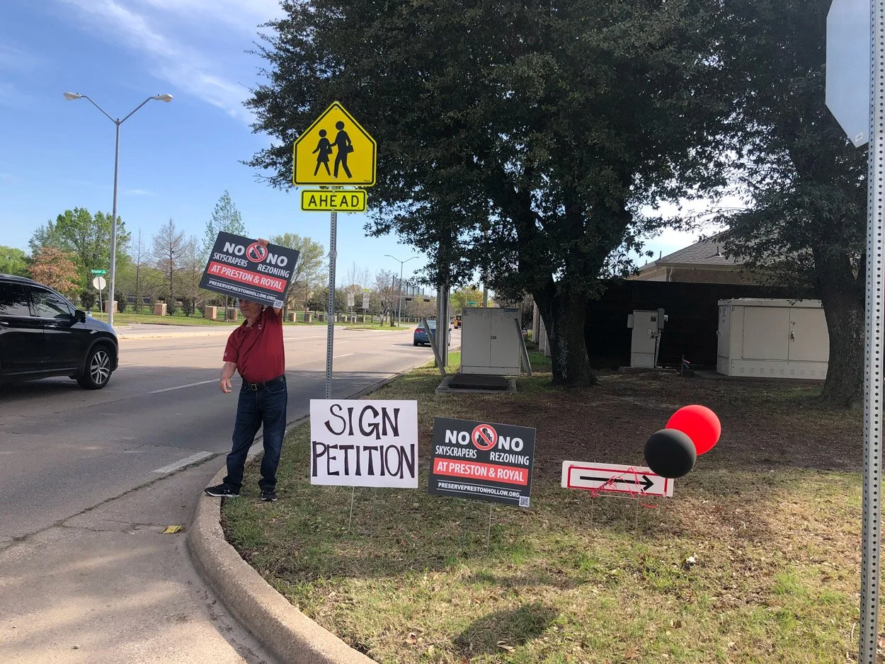 PPHC volunteer members encourage drivers-by along Preston Road near Orchid Lane to sign petitions
