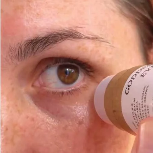Close-up of the eye area with Goddess Glow Eye Balm being applied