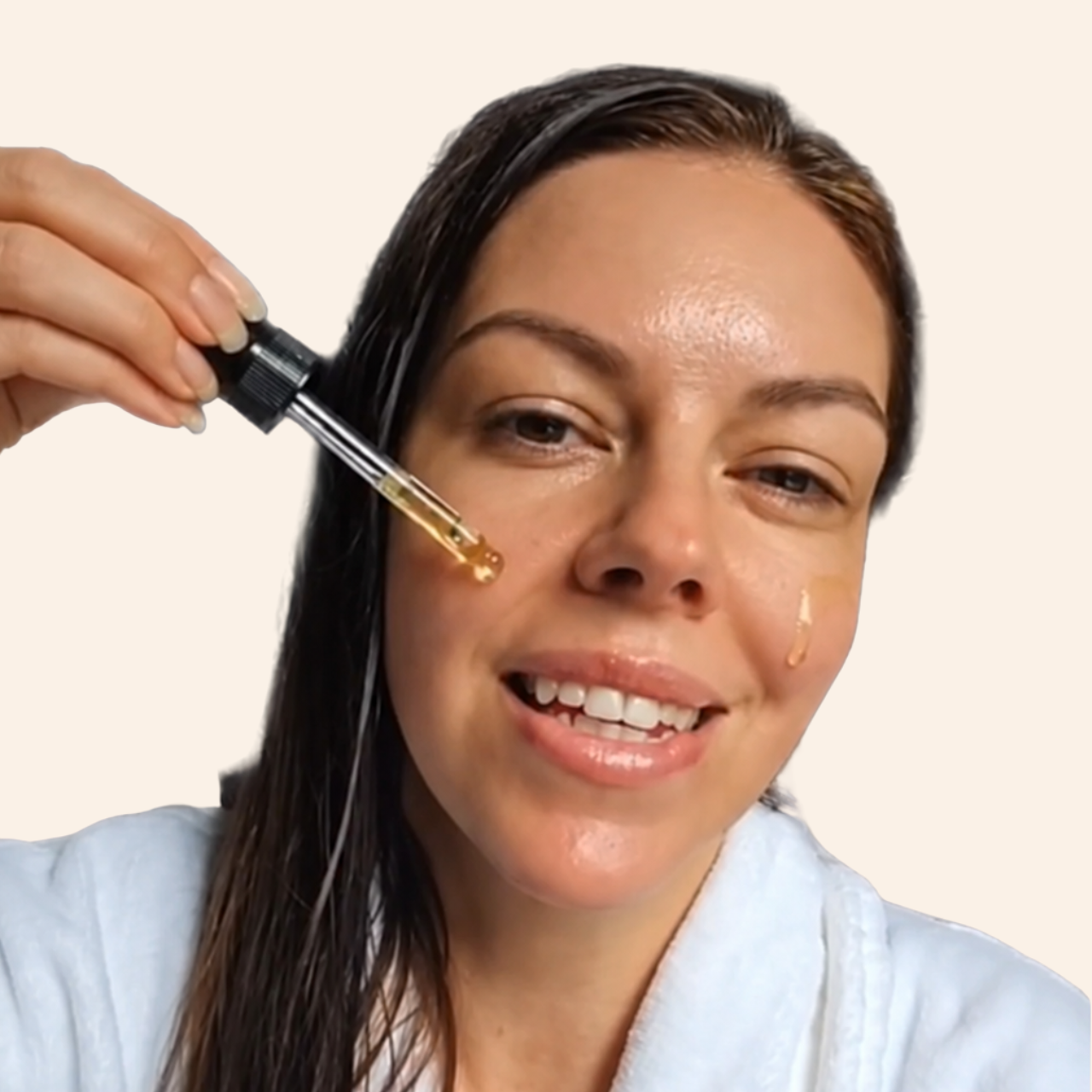 Goddess Ritual Face Oil applied to the cheek with the glass dropper