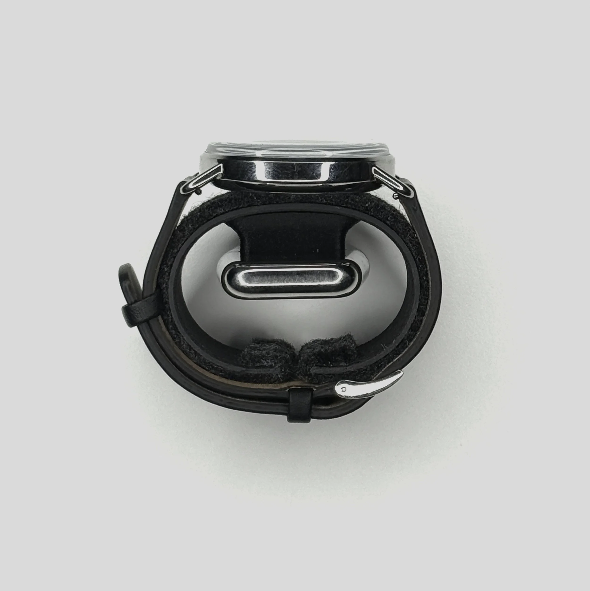 side view of a watch in the Watch.Sys carrier at showing the narrowest diameter of that the carrier can expand to ~6.5 inches
