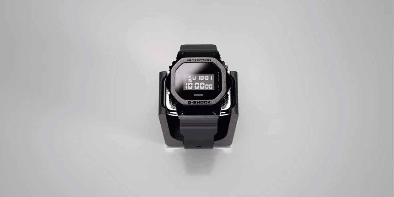 Black digital Casio G-Shock watch on white surface