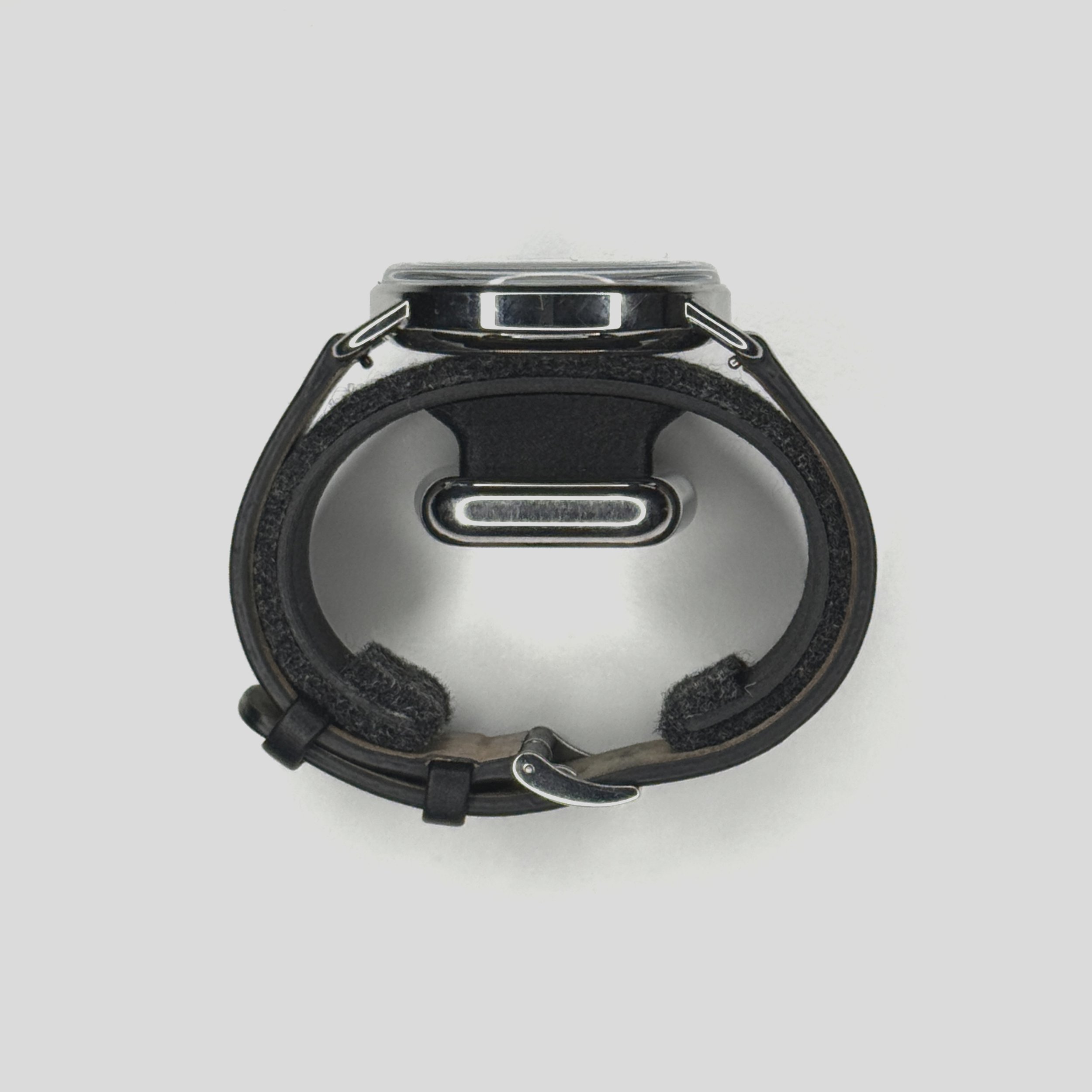 side view of a watch in the Watch.Sys carrier at showing the widest diameter of that the carrier can expand to ~7.75 inches