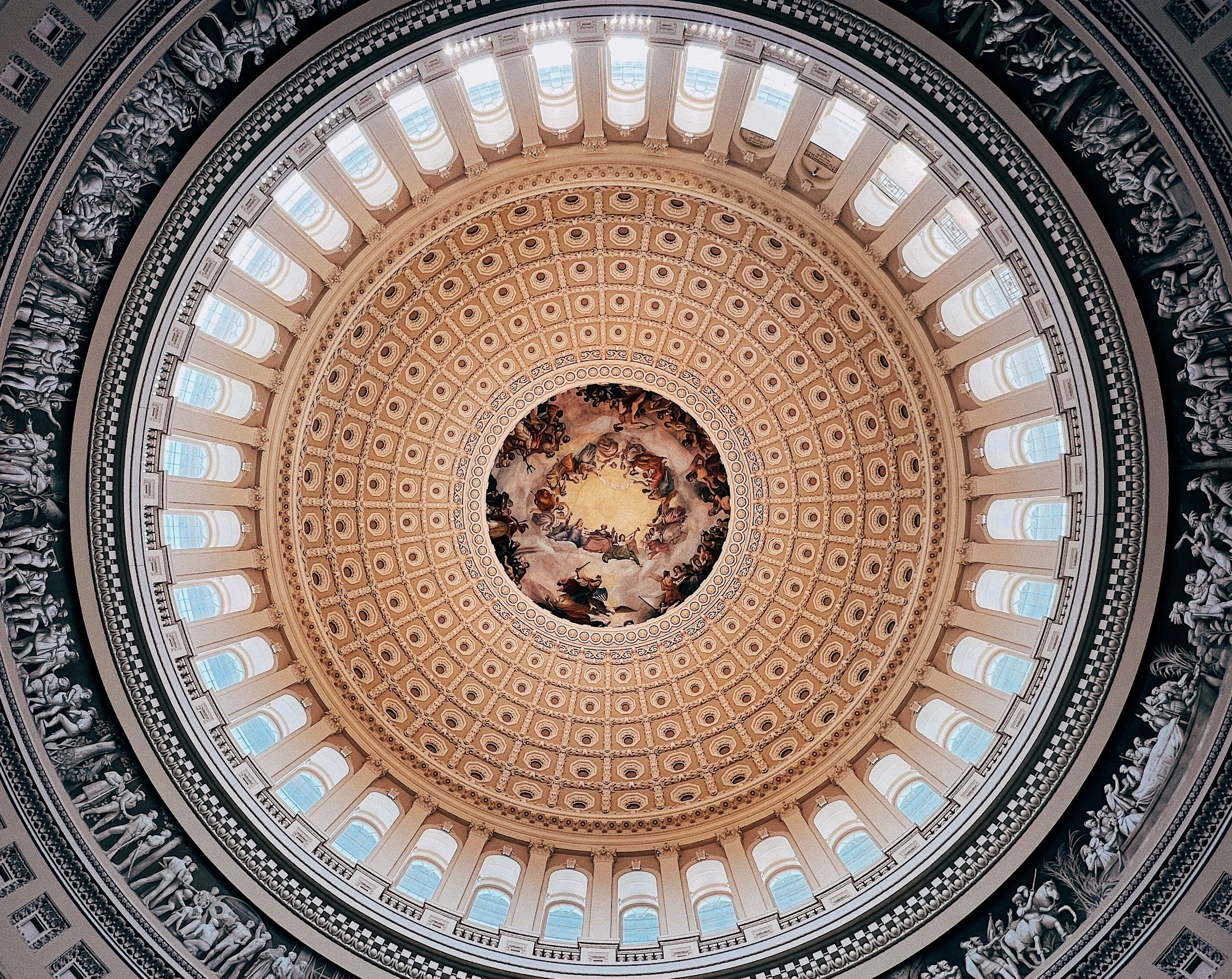 Standing beneath the historic dome of the U.S. Capitol Rotunda.
