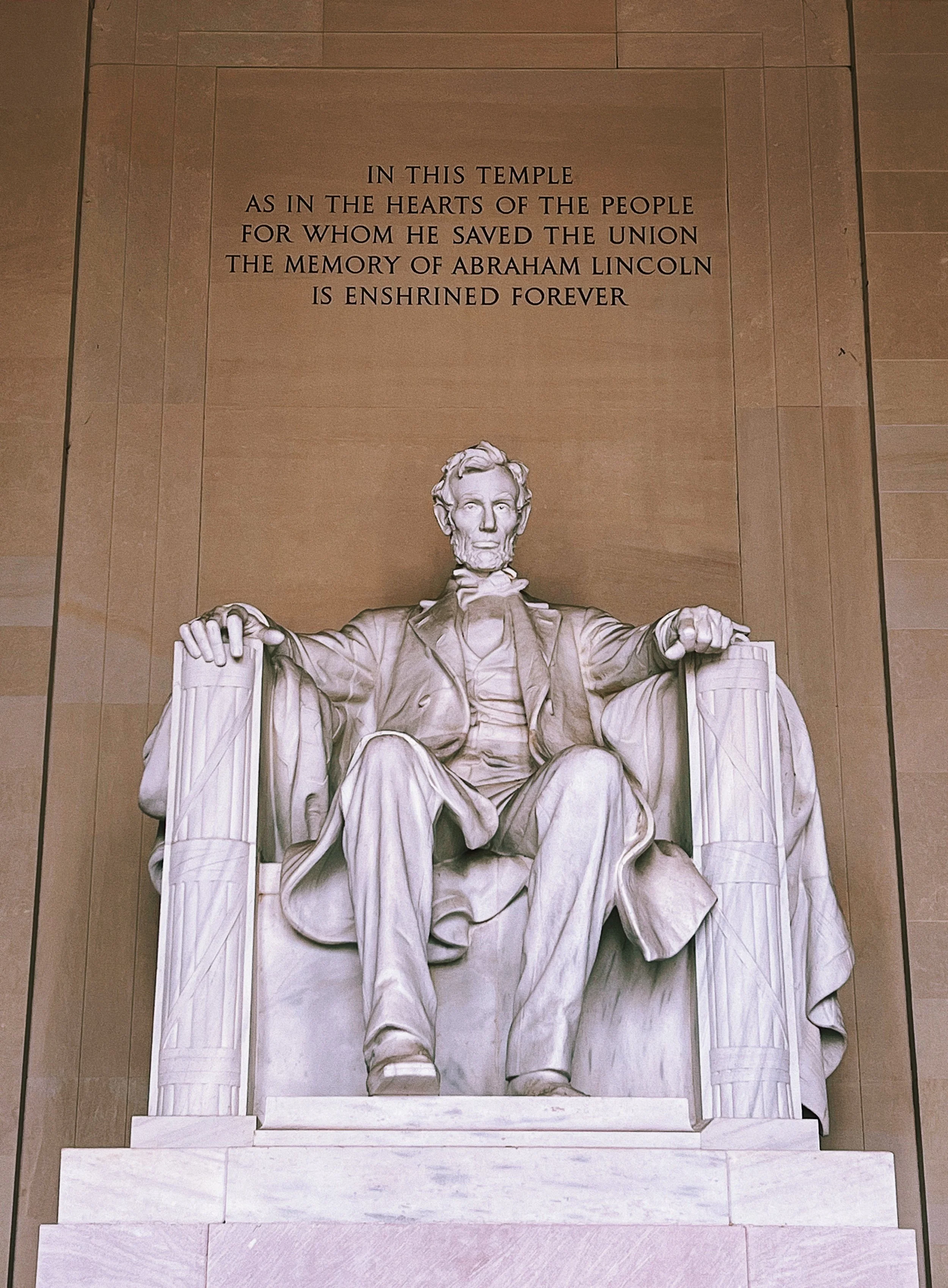 The marble statue of Abraham Lincoln sits enshrined within his memorial on the National Mall in Washington, D.C.