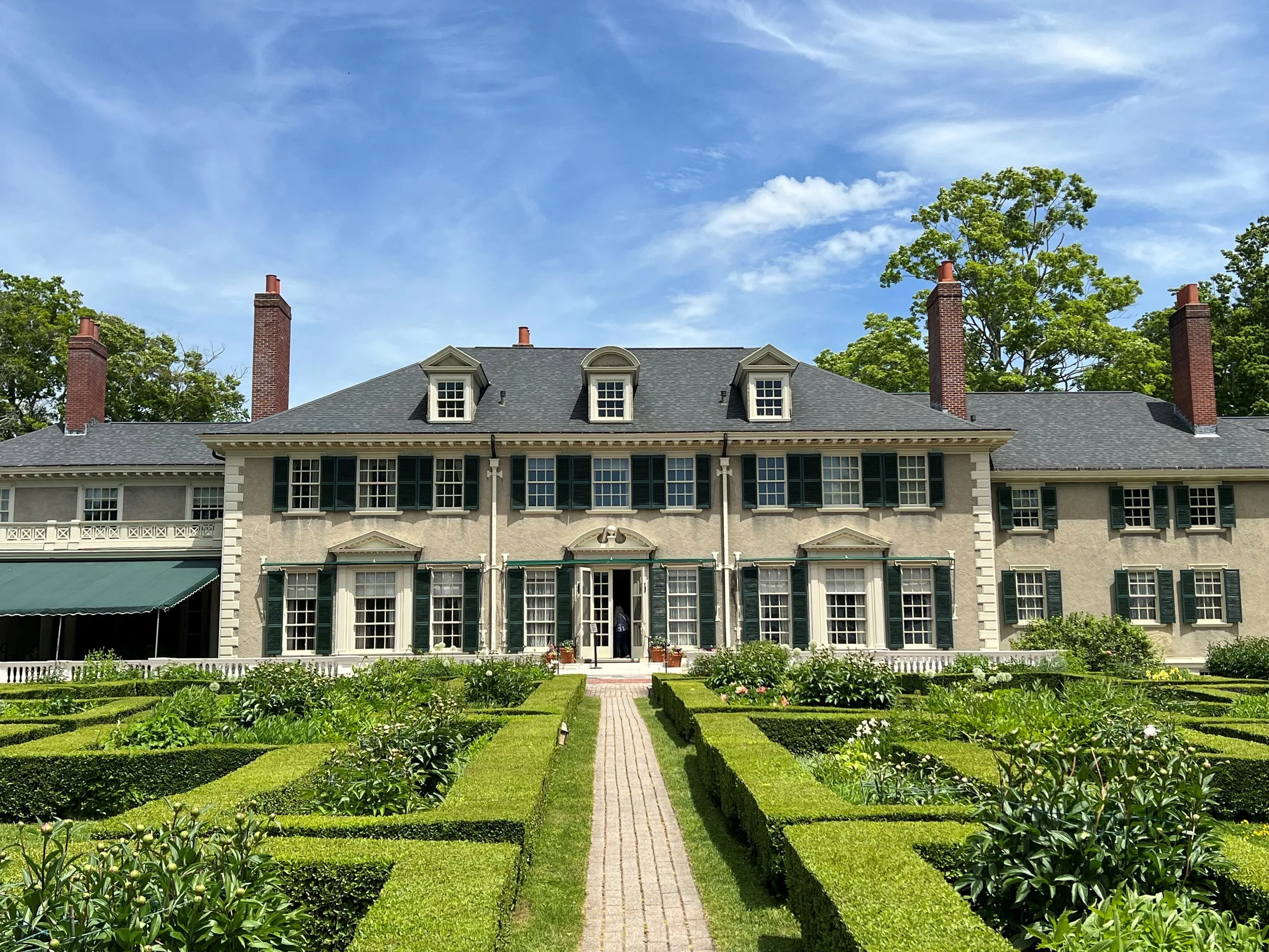 A view of Lincoln’s summer estate, framed by the gardens at Hildene in Vermont.
