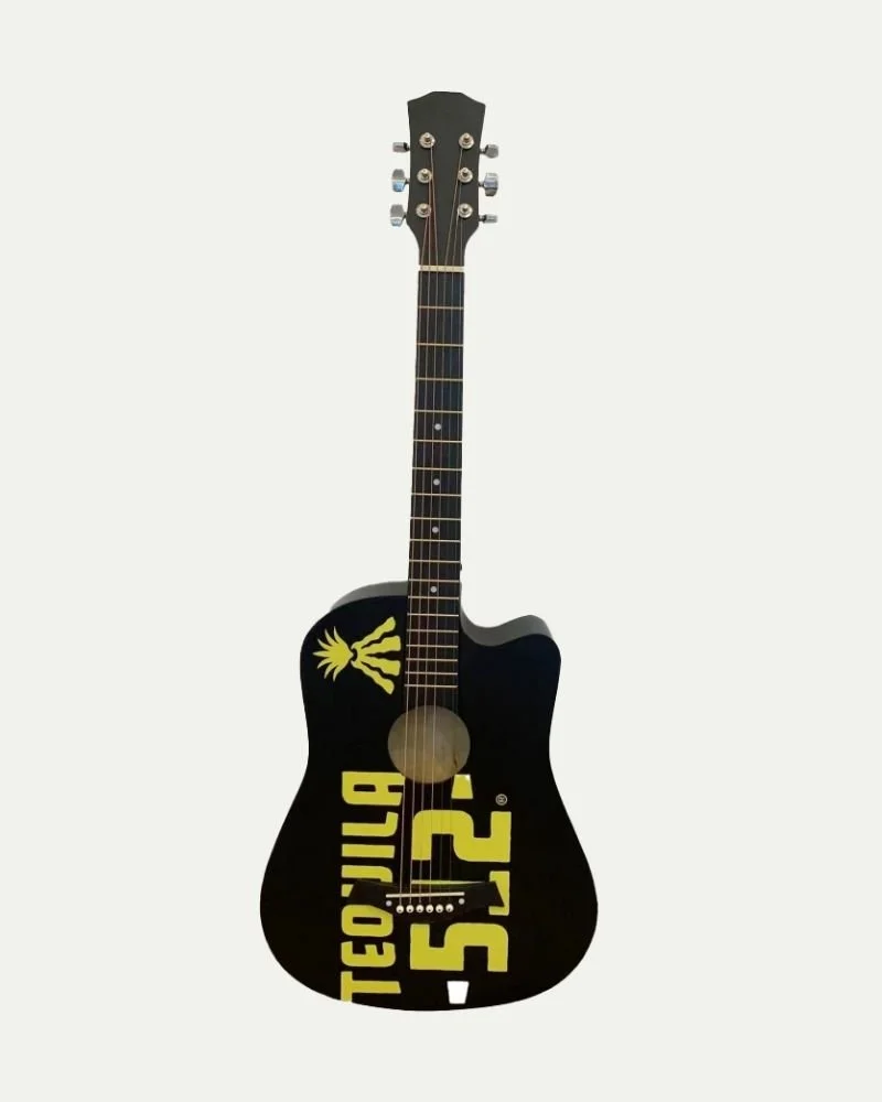 Black acoustic guitar decorated with yellow graphics and text, including a stylized pineapple logo and the words "TECNOLOGY" and "52" on the body.