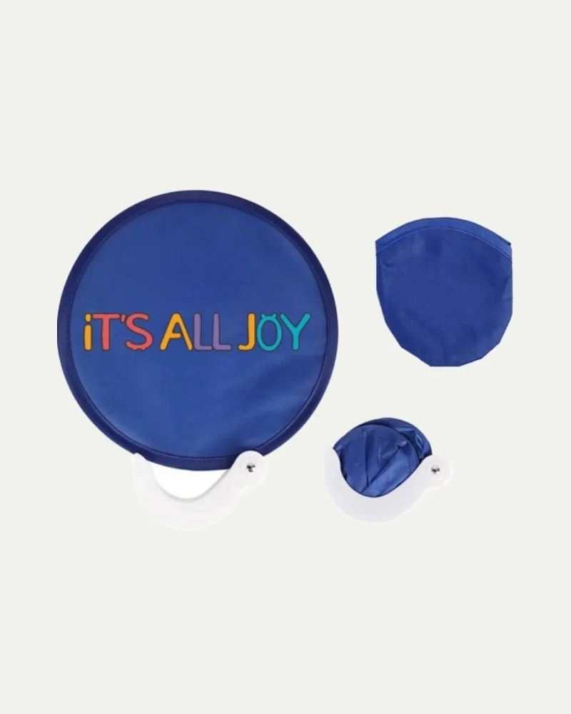 Blue frisbee with colorful text that reads 'It's All Joy', a blue face mask, and a small blue bag on a white background.