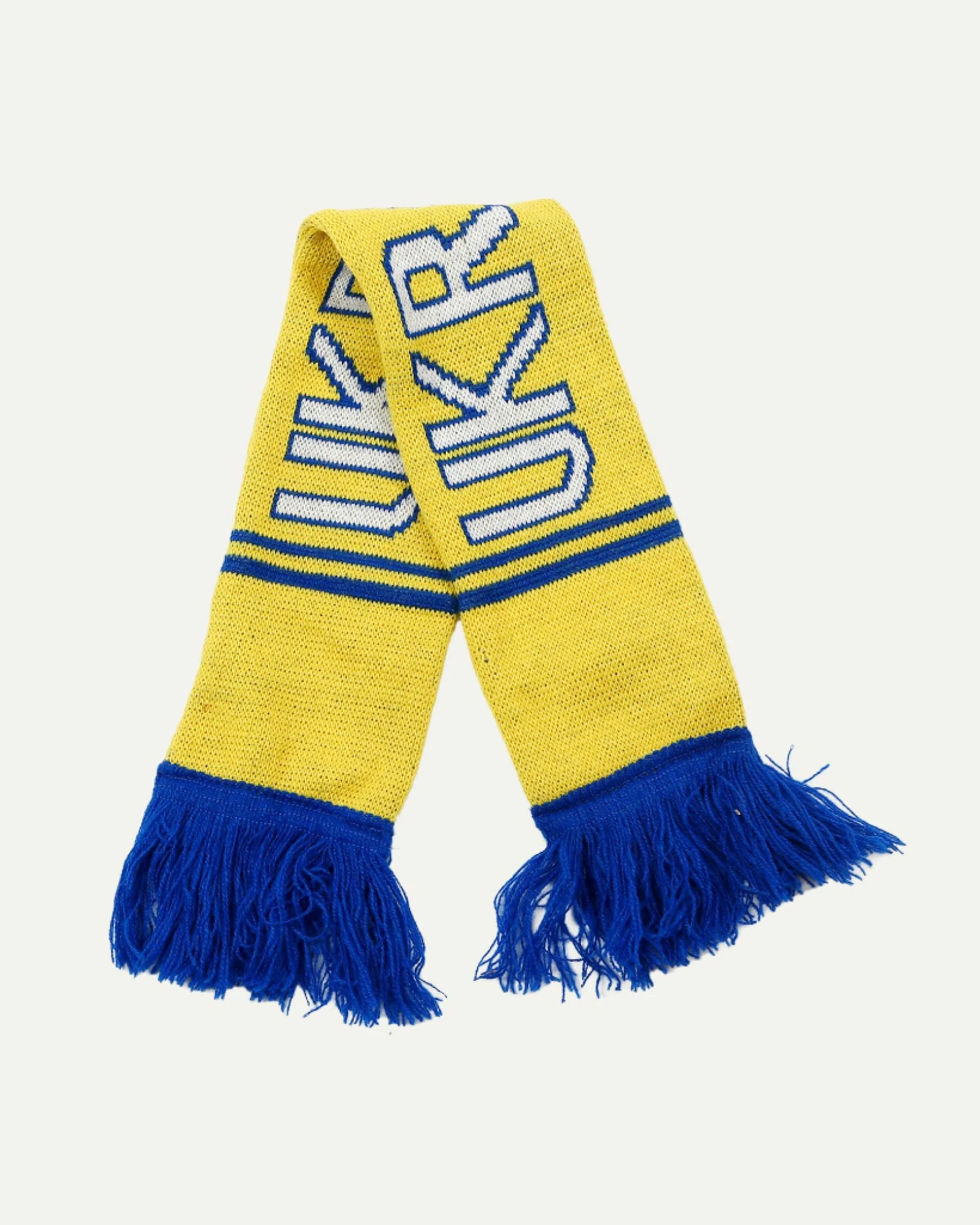 Yellow and blue sports scarf with fringe at ends and text pattern.