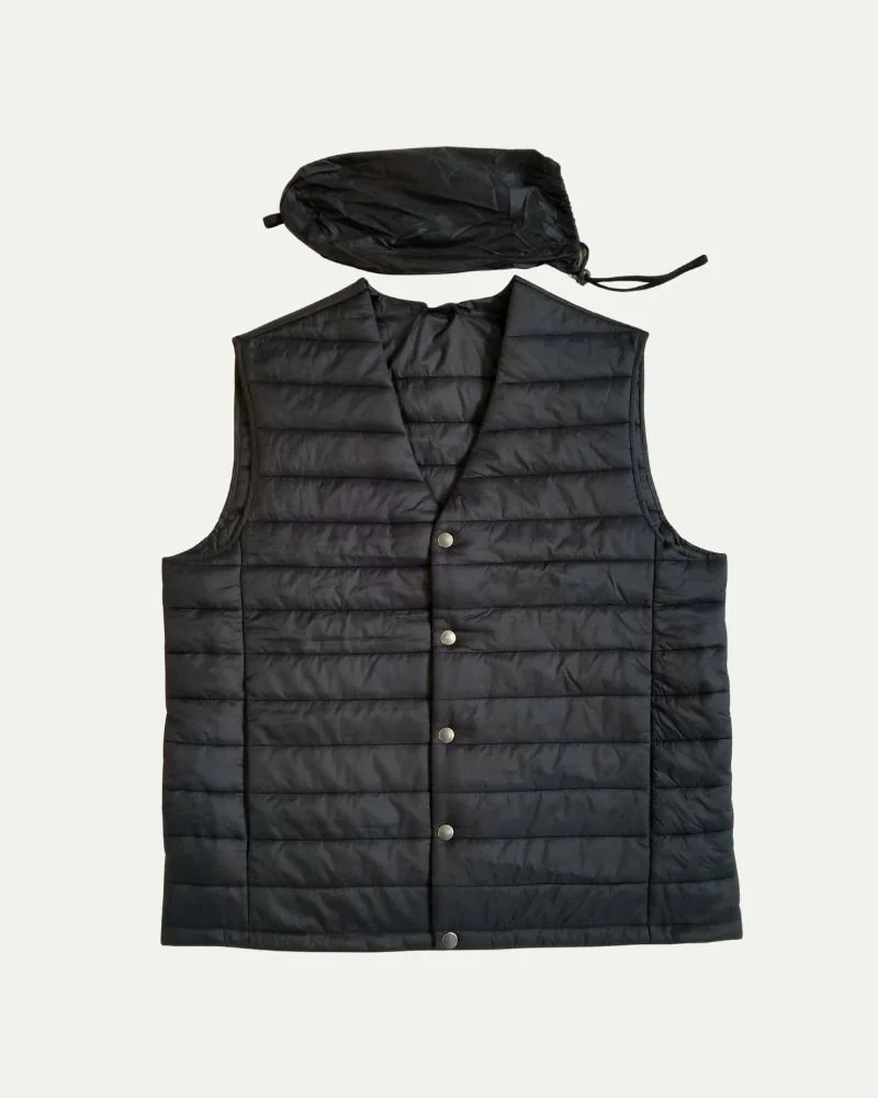Black quilted sleeveless vest with snap buttons and matching compact pack-up bag.