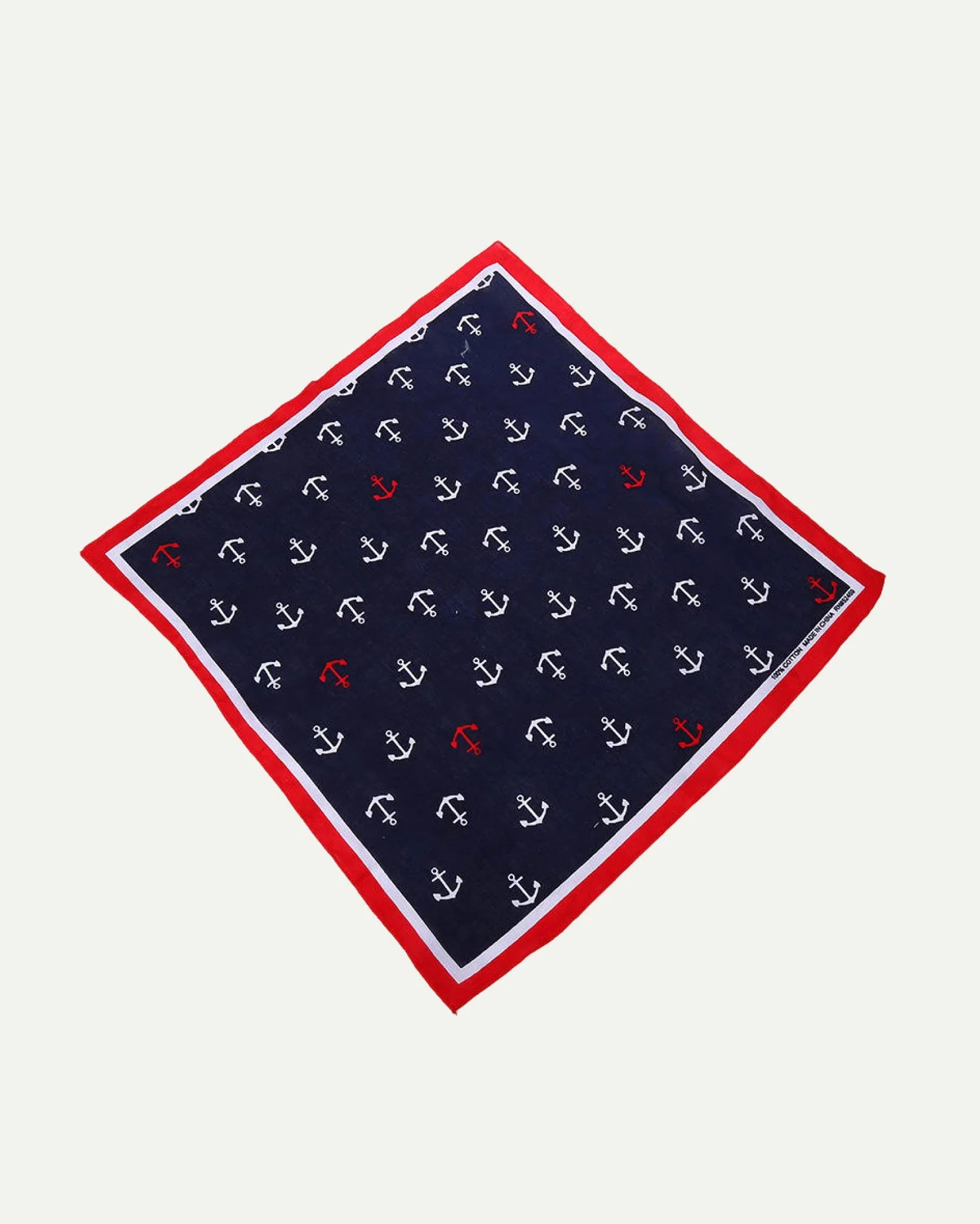 Navy blue bandana with white and red anchor patterns, red border, angled on a plain light background.