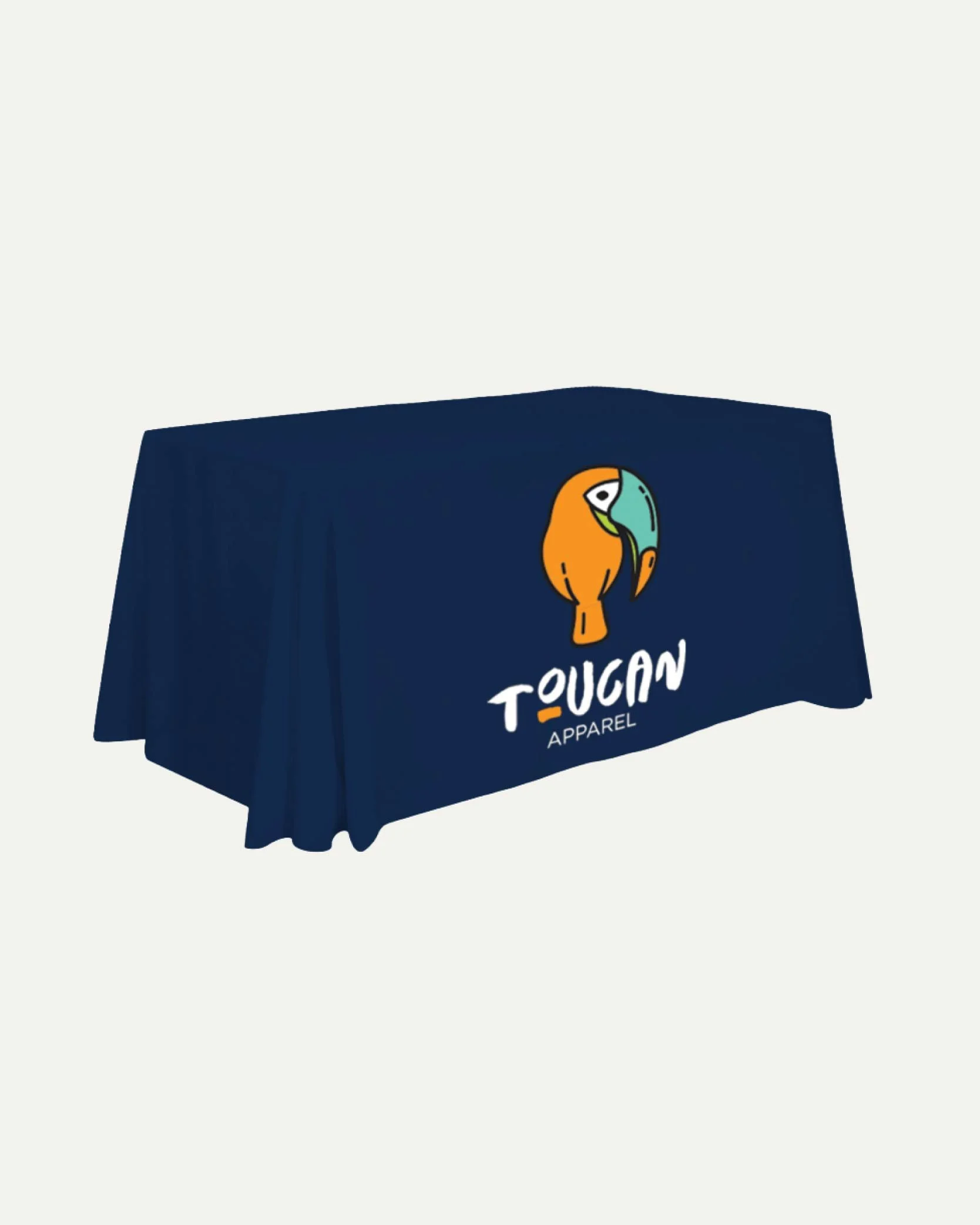 A navy blue tablecloth with a toucan logo and the text "Toucan Apparel" printed on it.