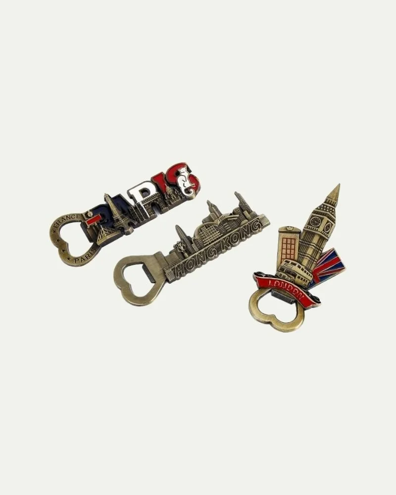 Three keychains depicting landmarks from Paris, Hong Kong, and London.
