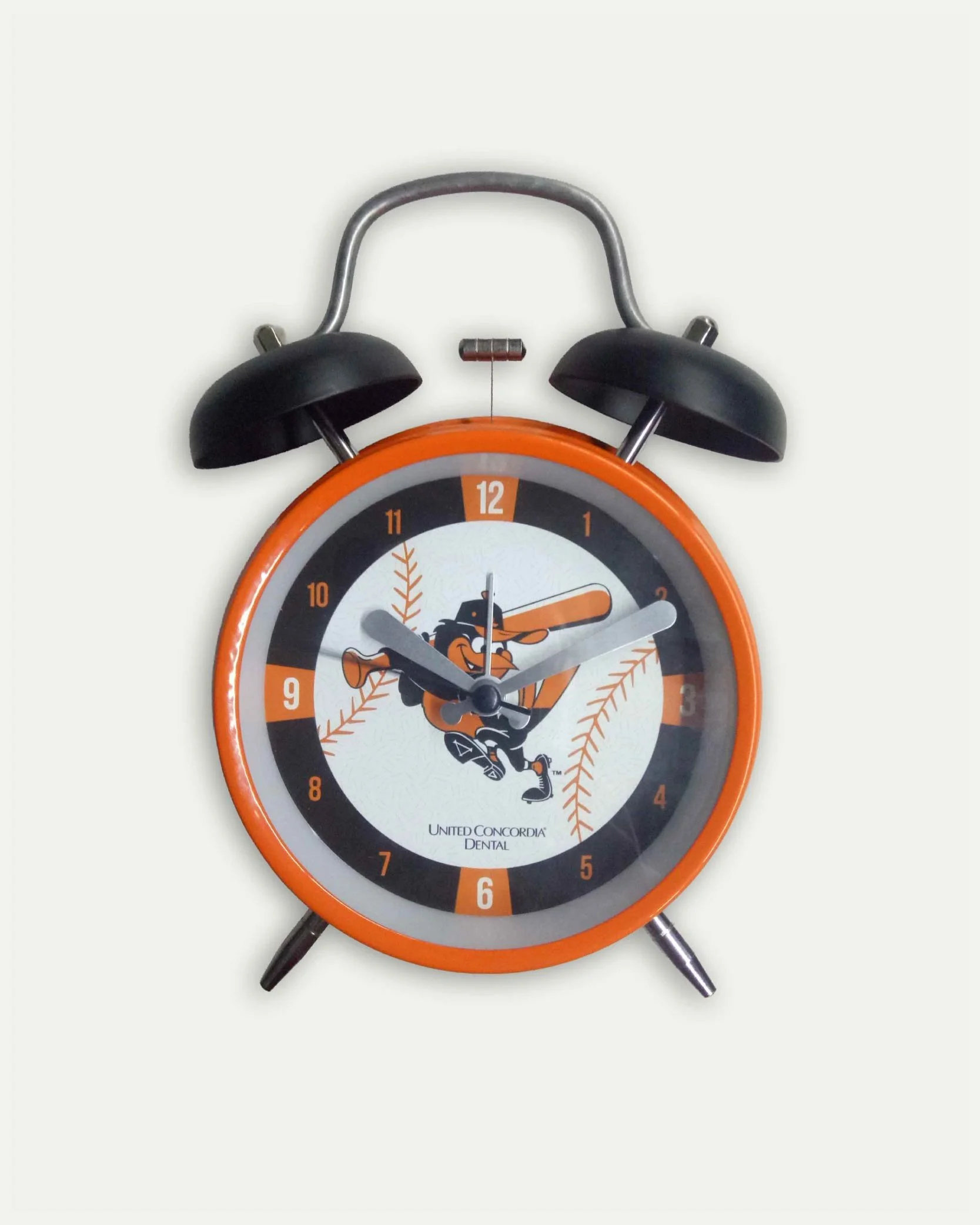 Alarm clock with a baseball theme and cartoon mascot playing a trumpet.