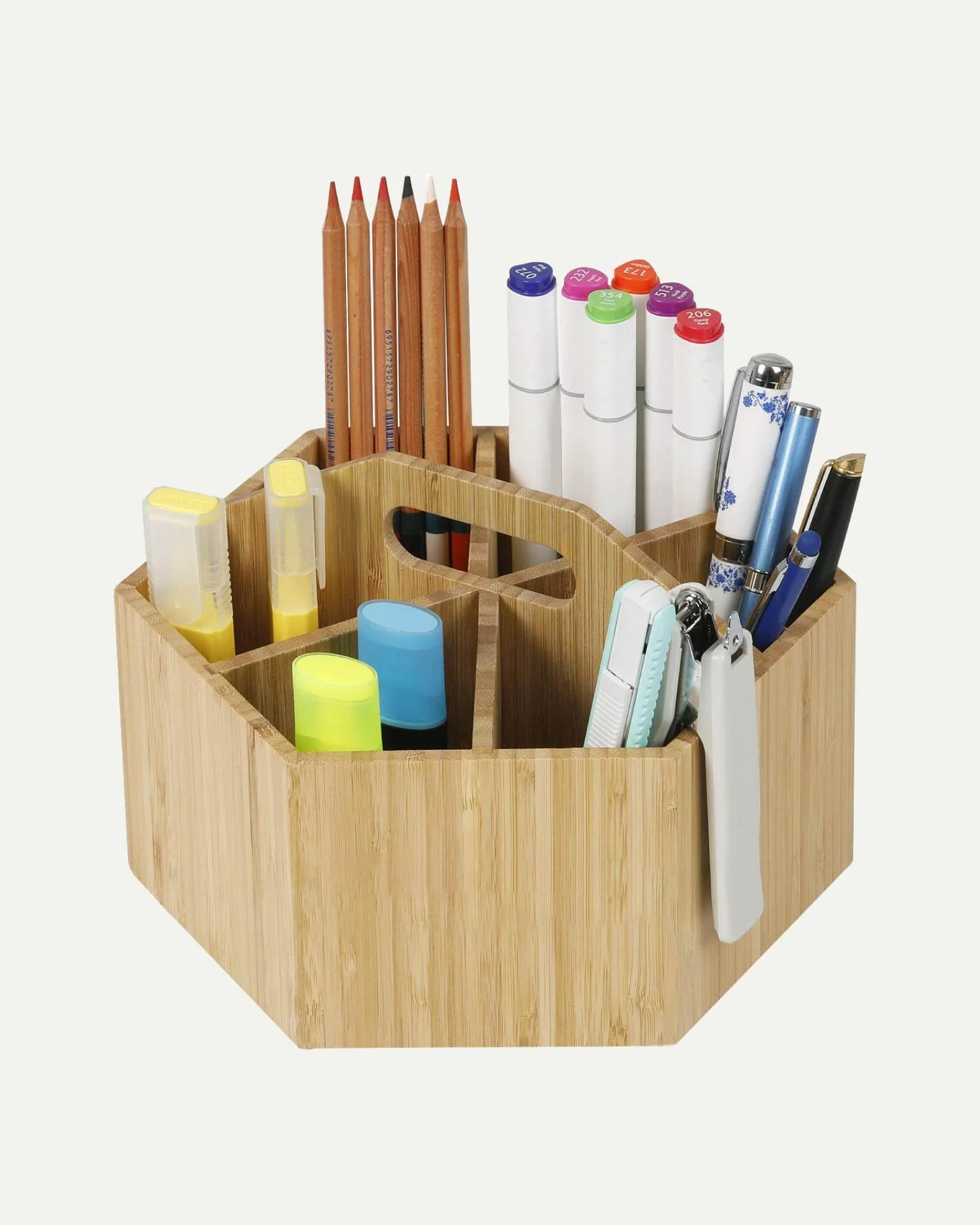 Wooden desk organizer containing colored pencils, markers, highlighters, a glue stick, a cutter, and pens.
