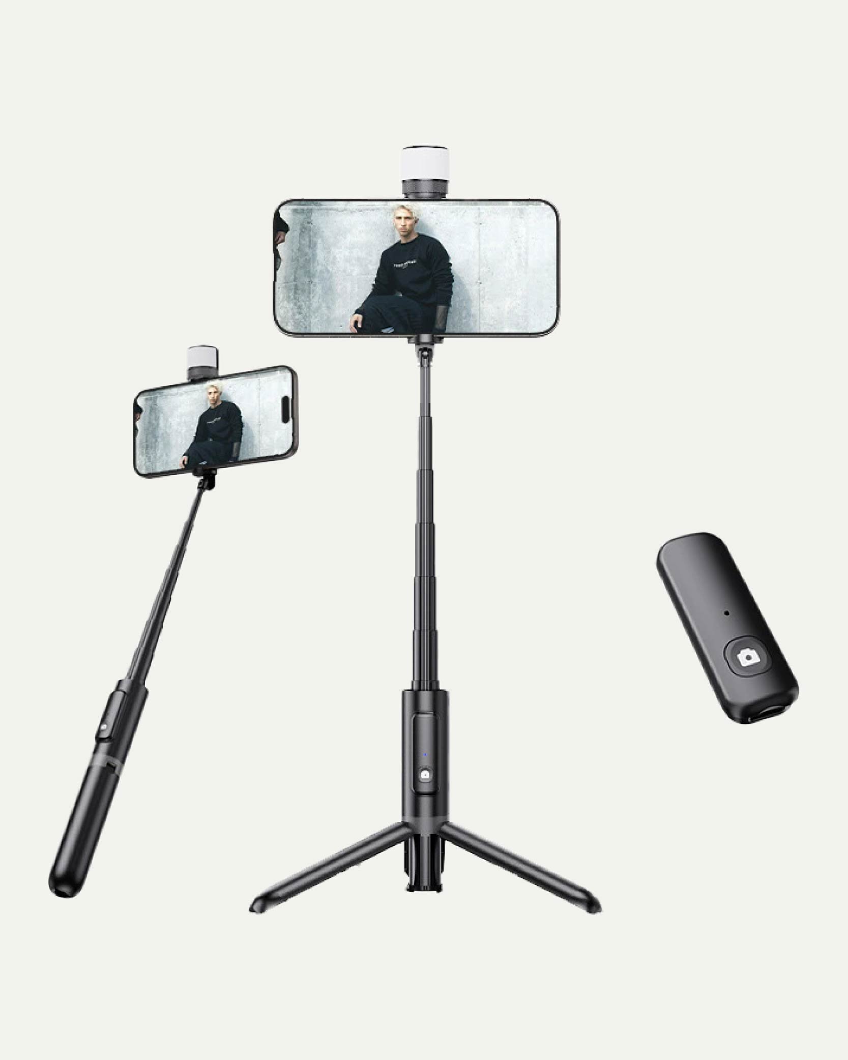 Two smartphones mounted on extendable selfie sticks and a wireless remote shutter.