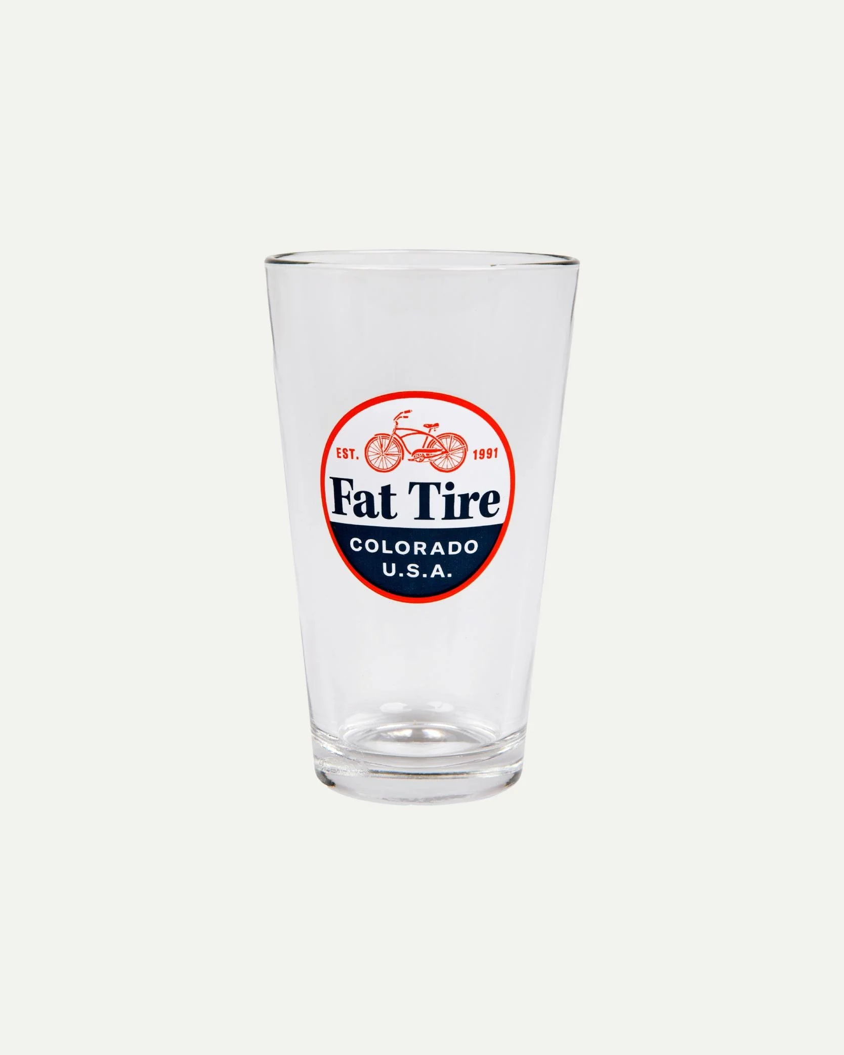 Clear glass with 'Fat Tire' logo, featuring a red bicycle and text, on a light background.