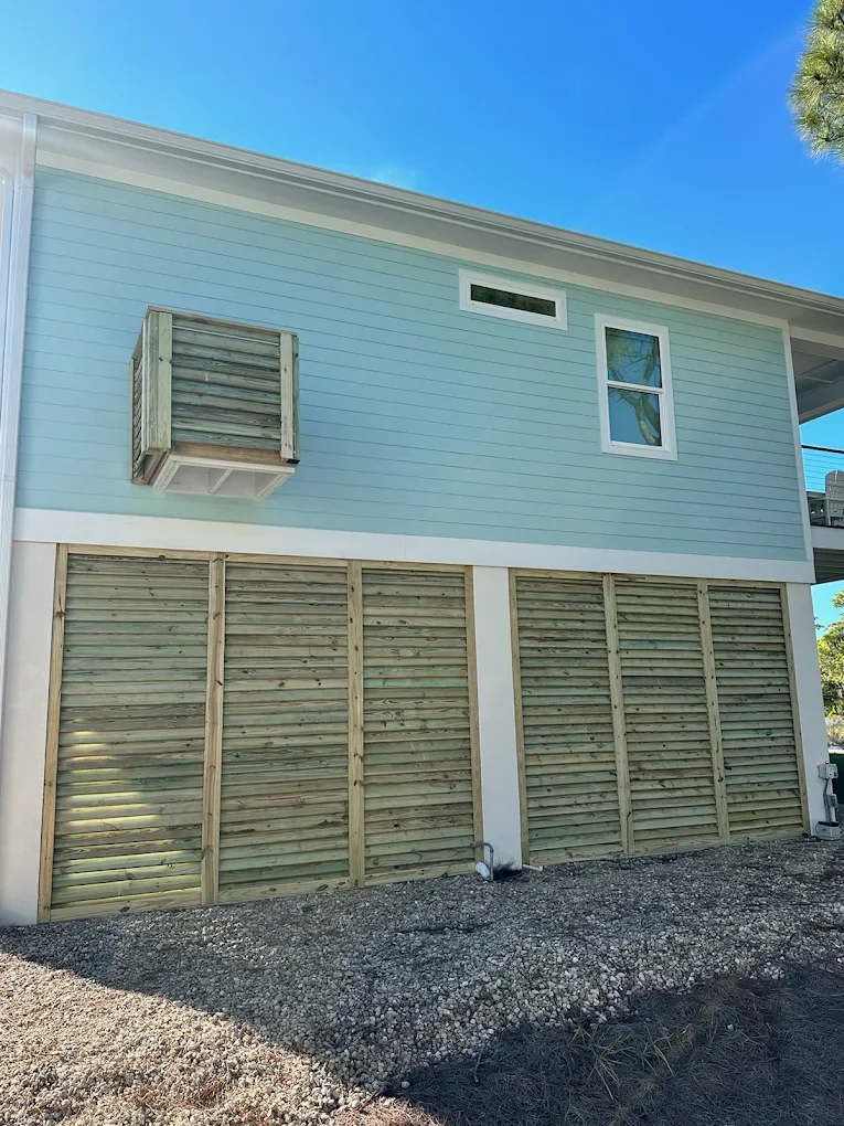 Privacy slats under a stilt built home.