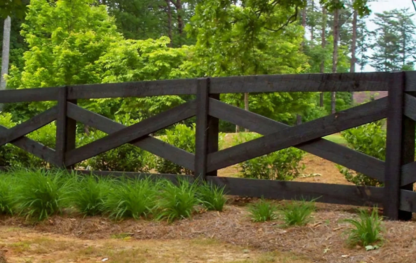 Black wooden farm style fence.