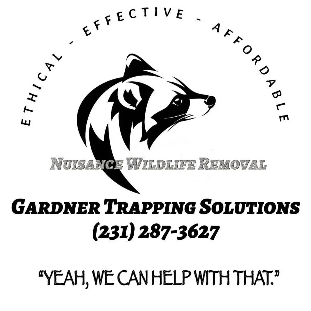 A logo for Gardner Trapping Solutions featuring a stylized raccoon's head and text advertising wildlife removal services and a phone number.