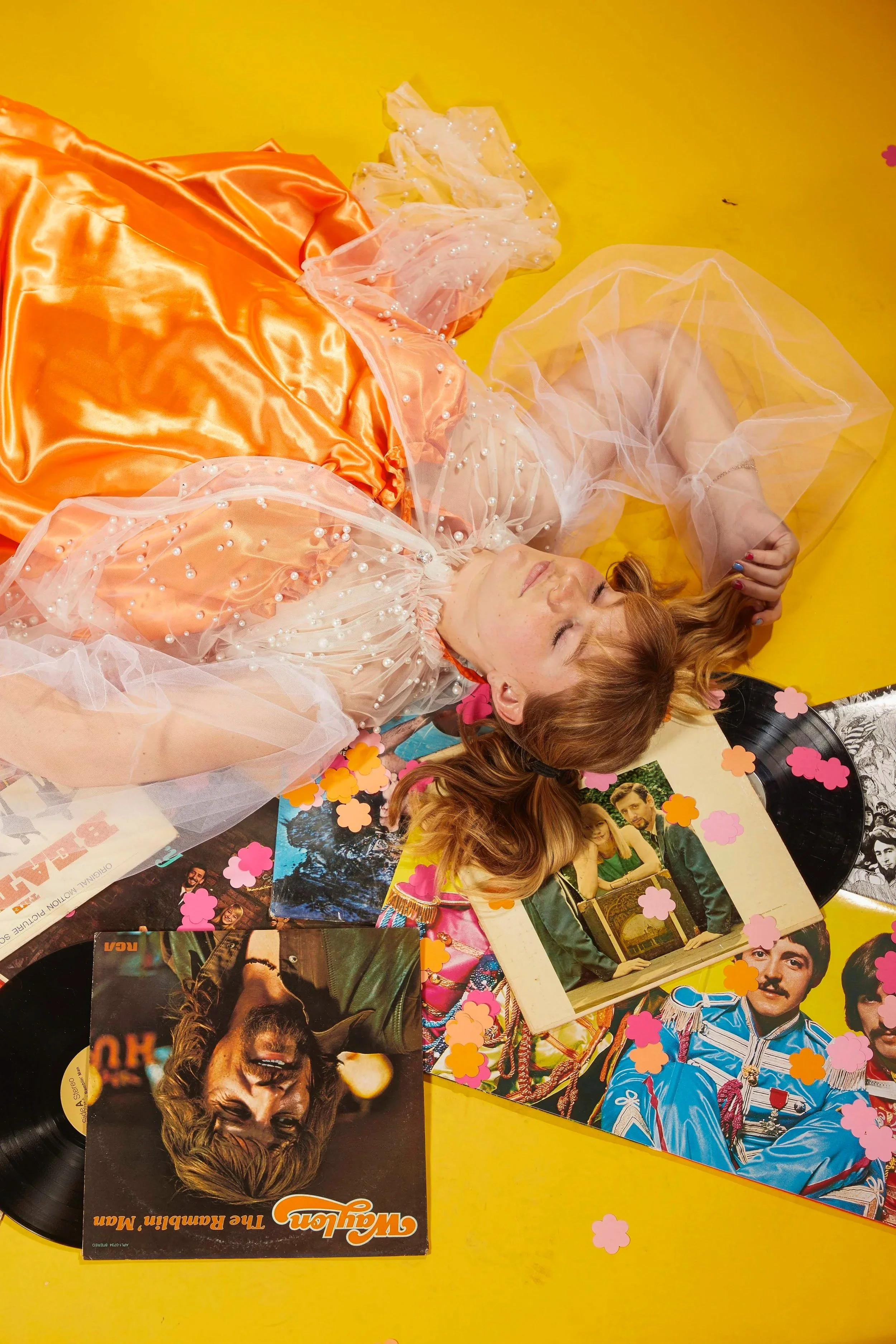Photograph for an album cover. Records surround the girl. Fashion Photography